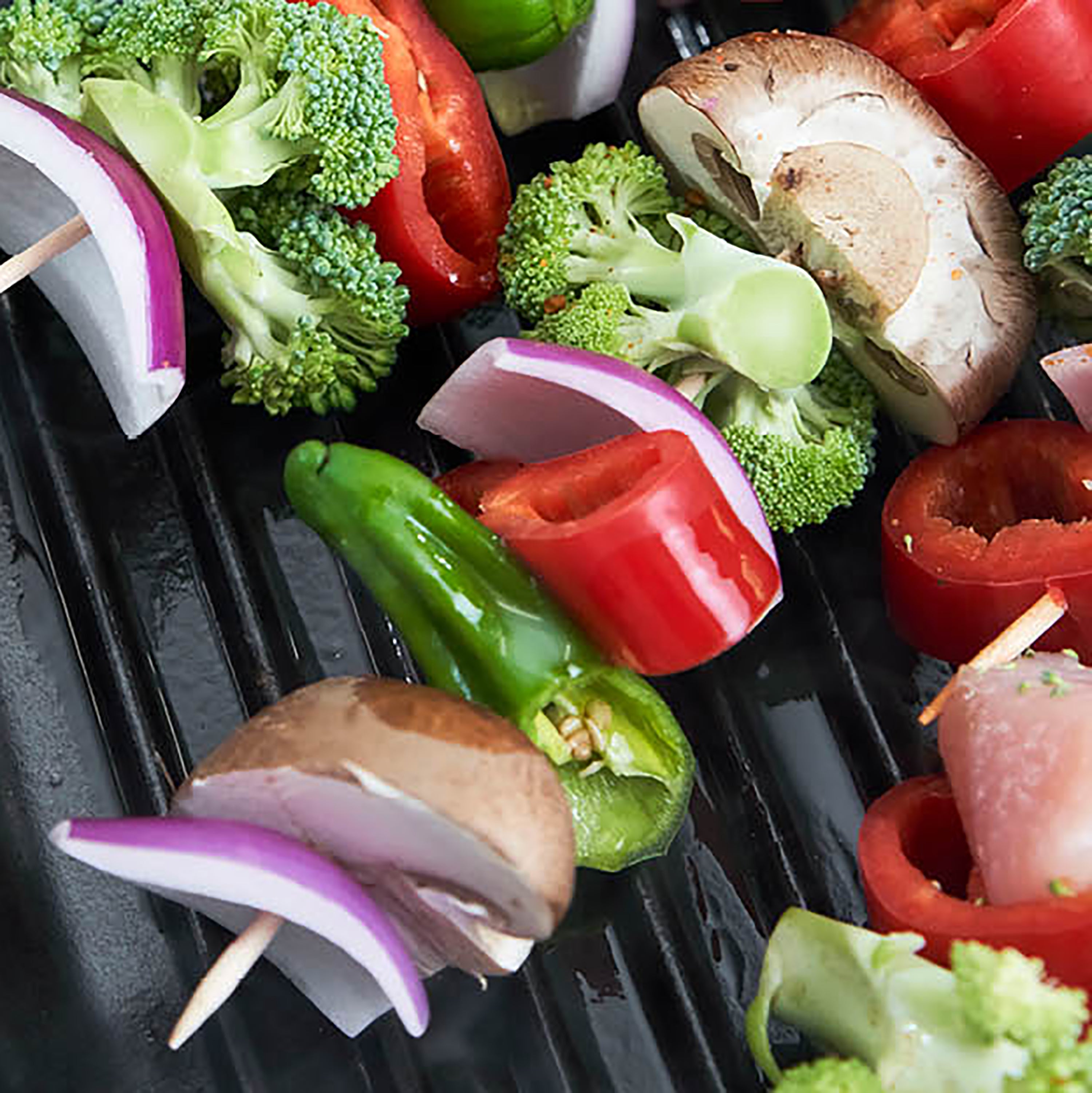 Staub 10-inch grill pan captured from above, showcasing its matte black finish and textured interior.