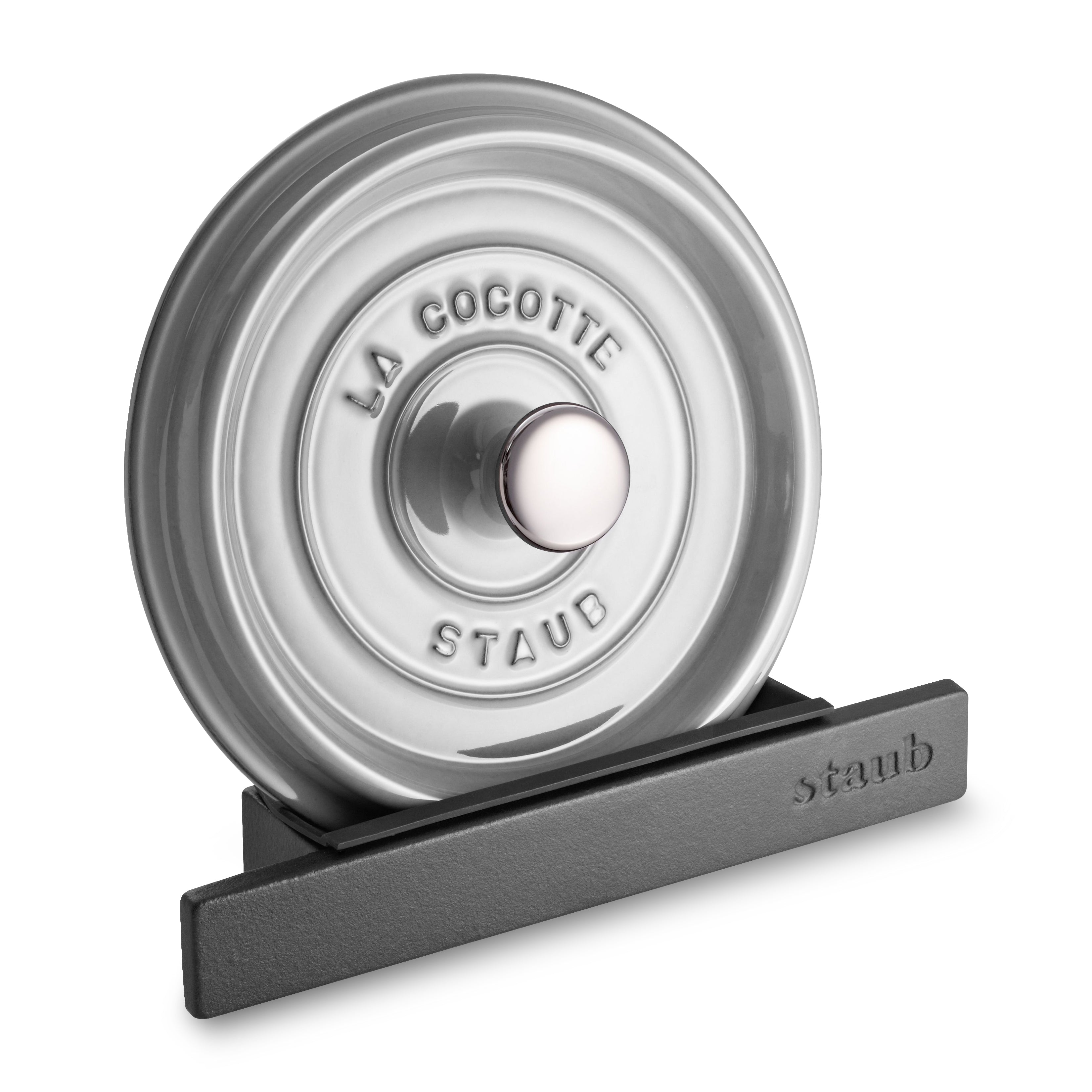 Heavy-duty cast iron lid holder with silicone drip protector on a kitchen countertop