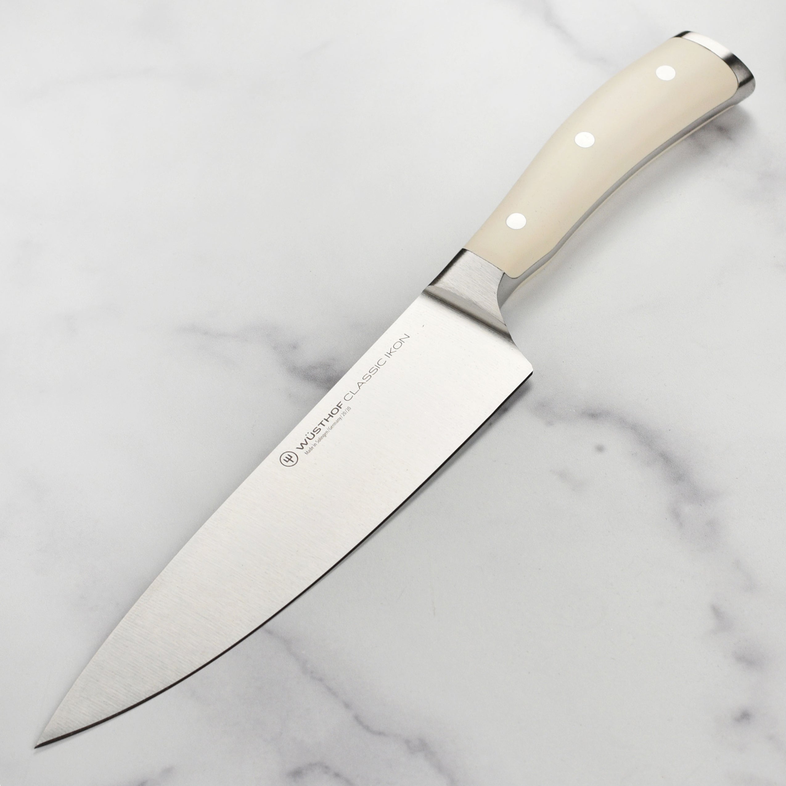 Wusthof Classic Ikon 8-Inch Chef's Knife showcasing its sharp blade and ergonomic handle angle