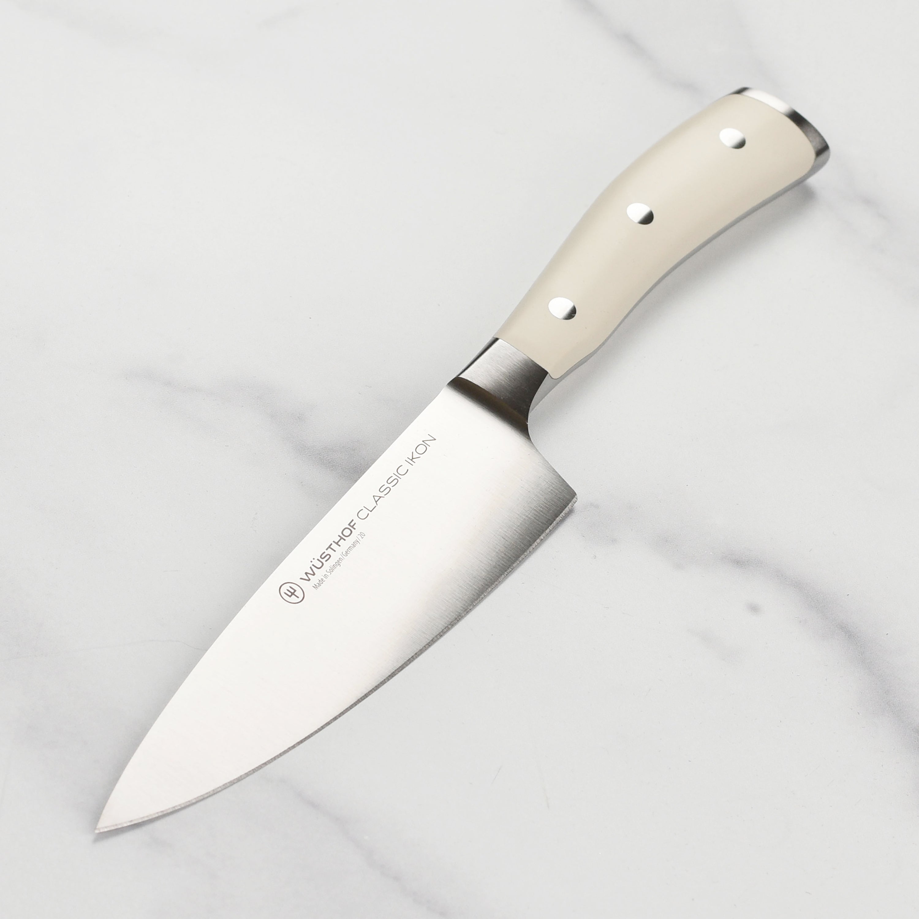 Wüsthof Classic Ikon Creme 6-inch chef's knife blade close-up for precise slicing