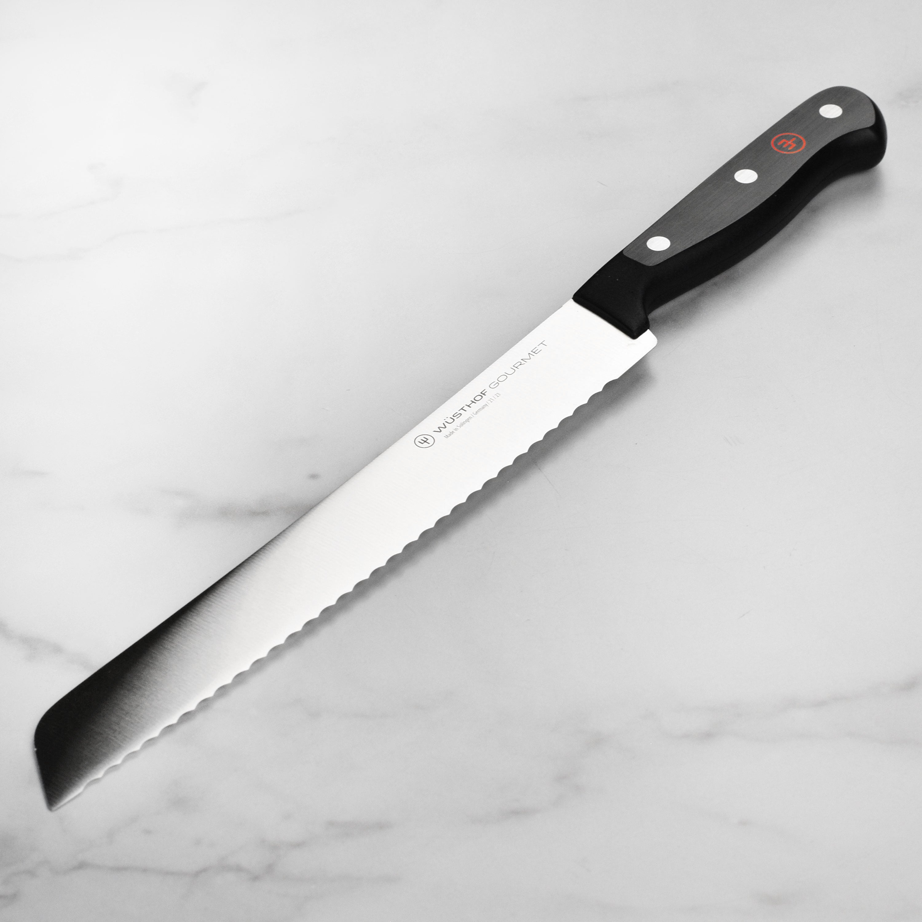 Wusthof Gourmet 9-Inch Bread Knife showcasing the high-carbon stainless steel blade from a side angle.