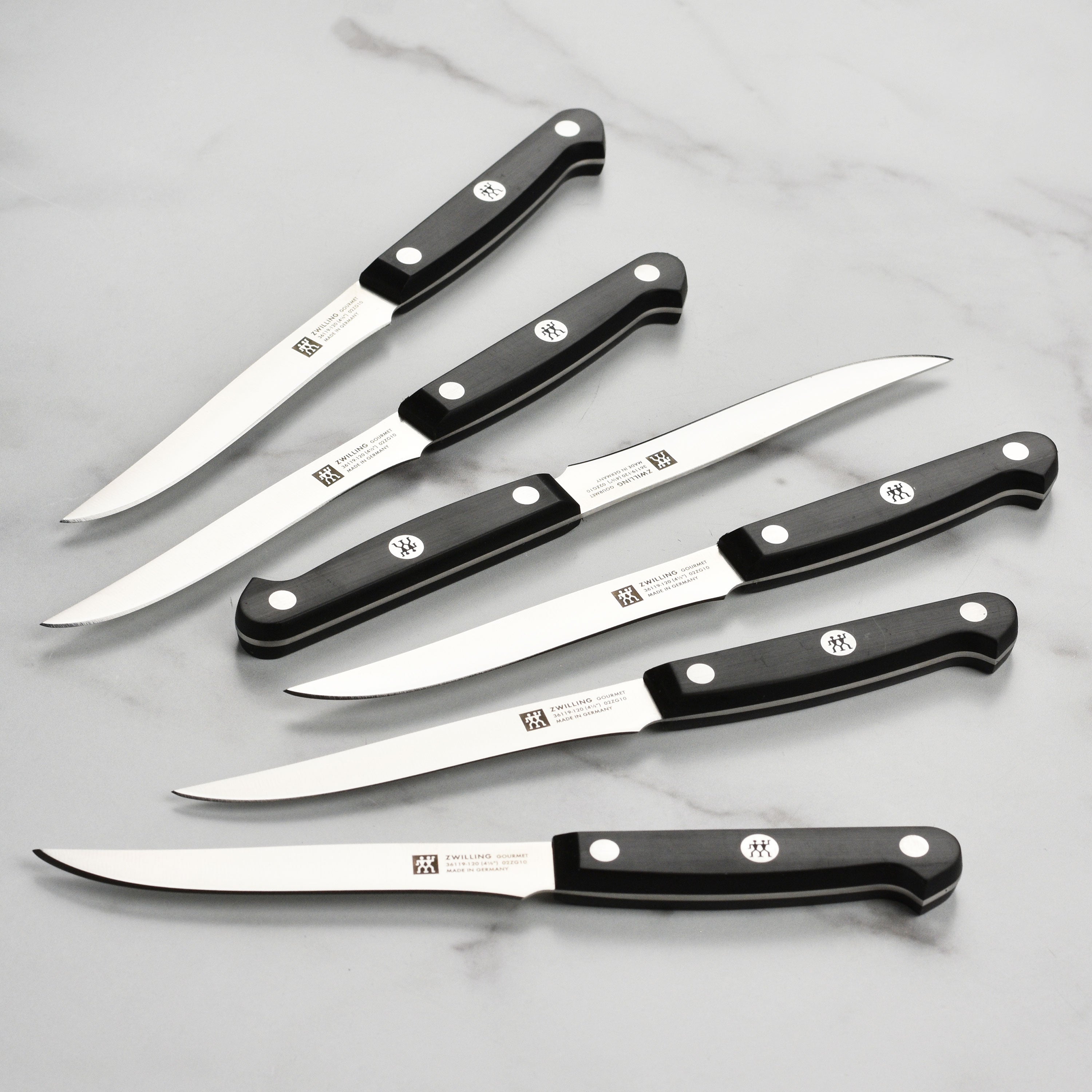 Close-up of Zwilling Gourmet steak knife highlighting the high carbon stainless steel blade and precision edge.