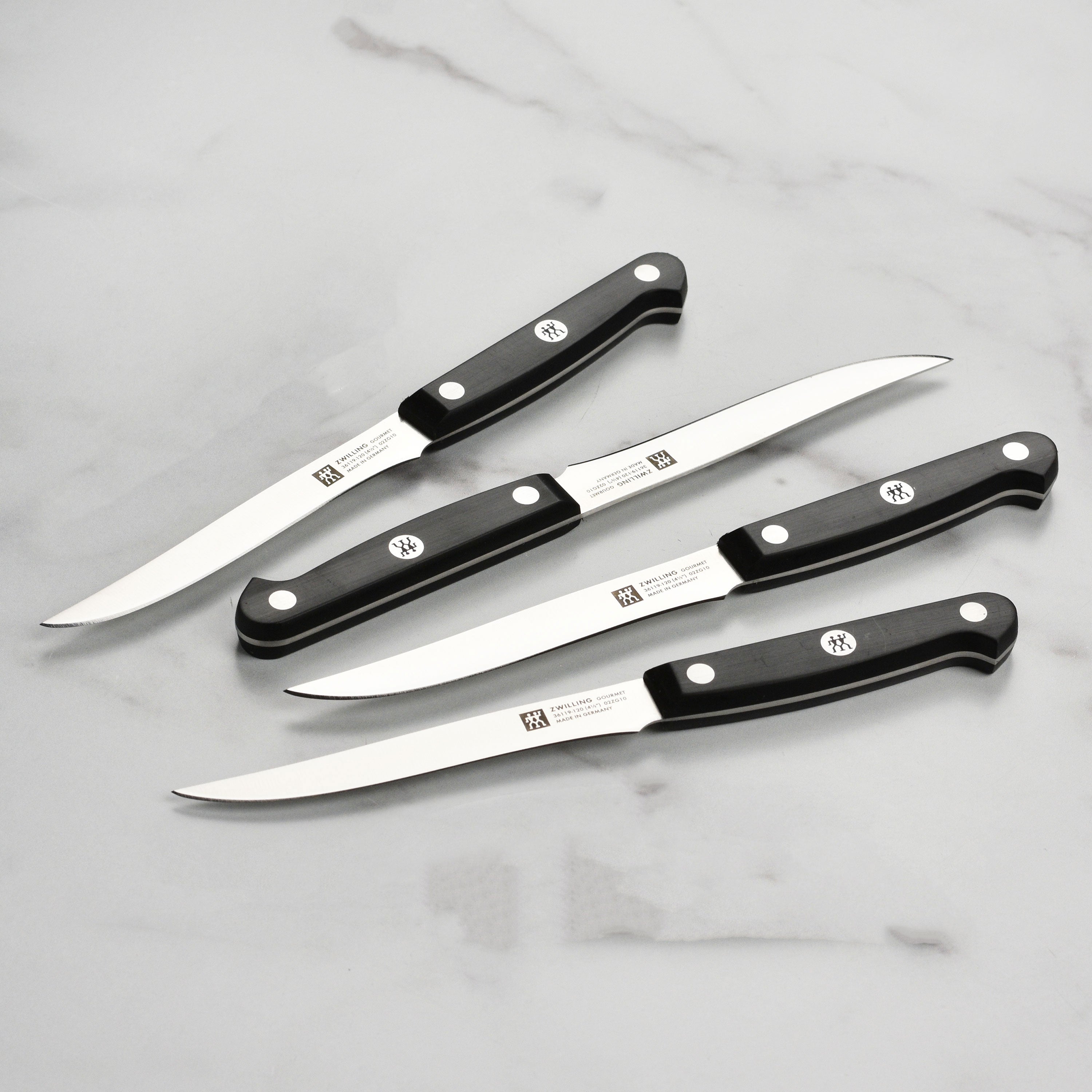 Close-up of Zwilling steak knife blade highlighting the precision edge and craftsmanship.