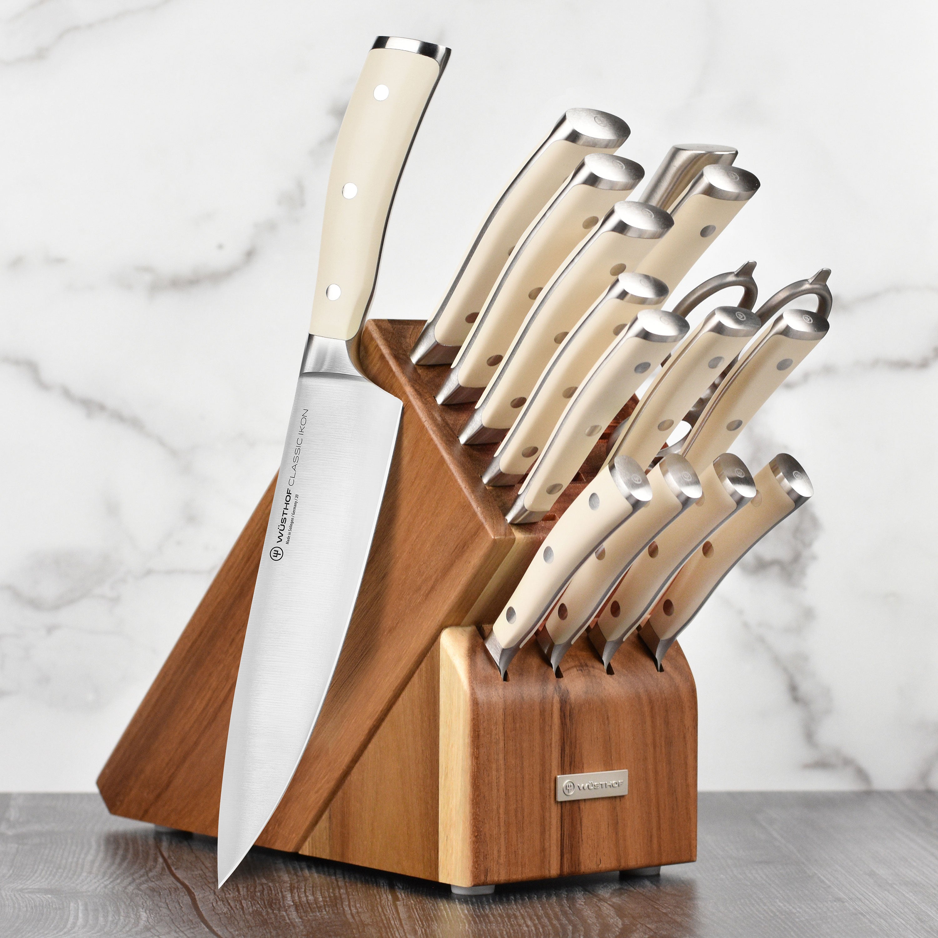Wusthof Classic Ikon 16-piece knife set displayed in an acacia block, showcasing its elegant design and craftsmanship.