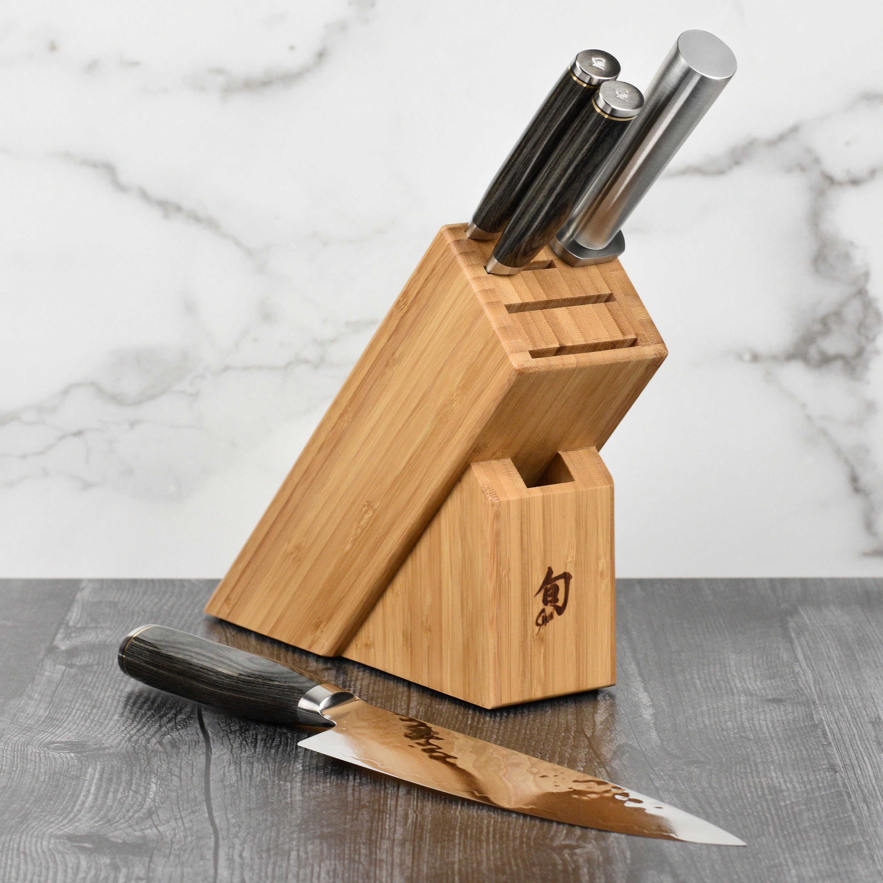 Japanese chef knife with Damascus steel blade in a modern kitchen