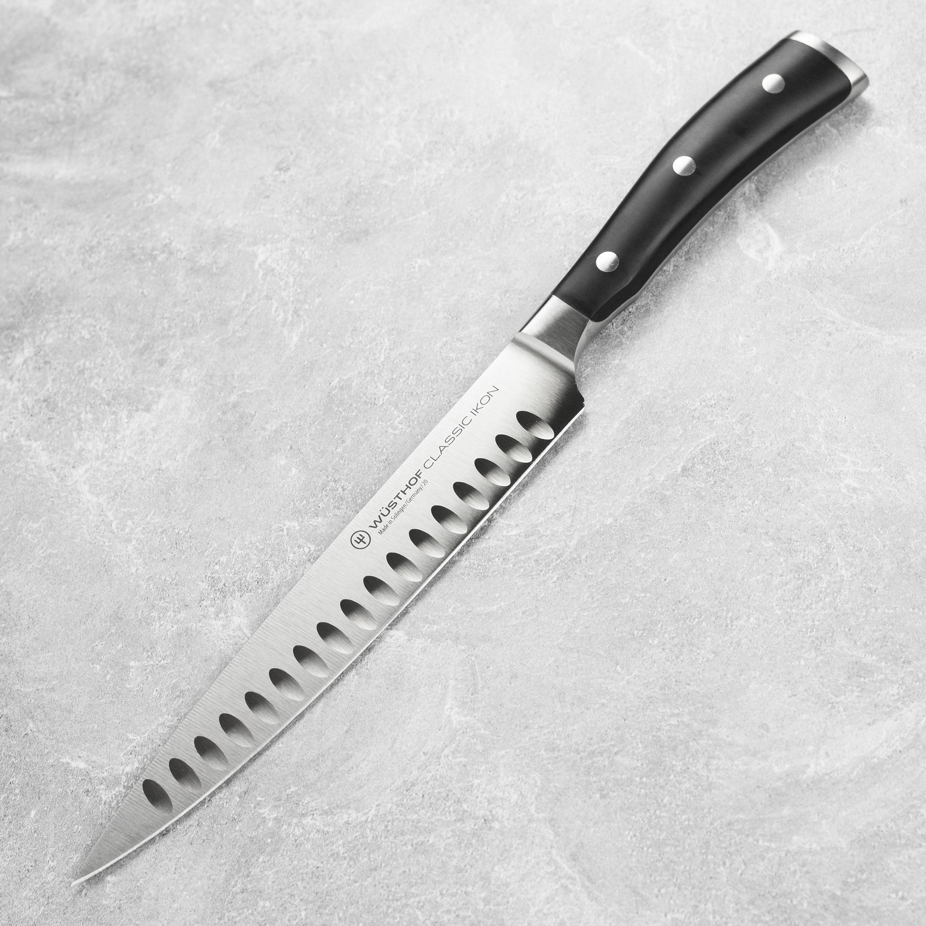 Wusthof 8 inch carving knife showing full-tang blade and ergonomic black handle