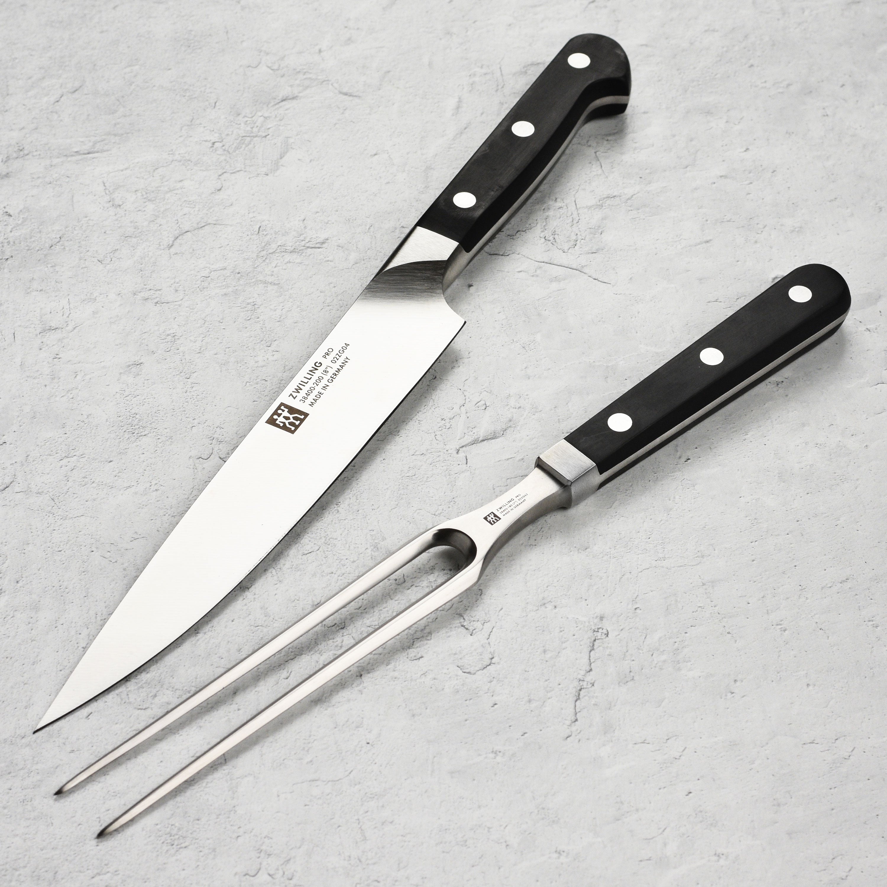 Premium German carving knife set displayed on a wooden cutting board, showcasing its sleek design and sharp blades.