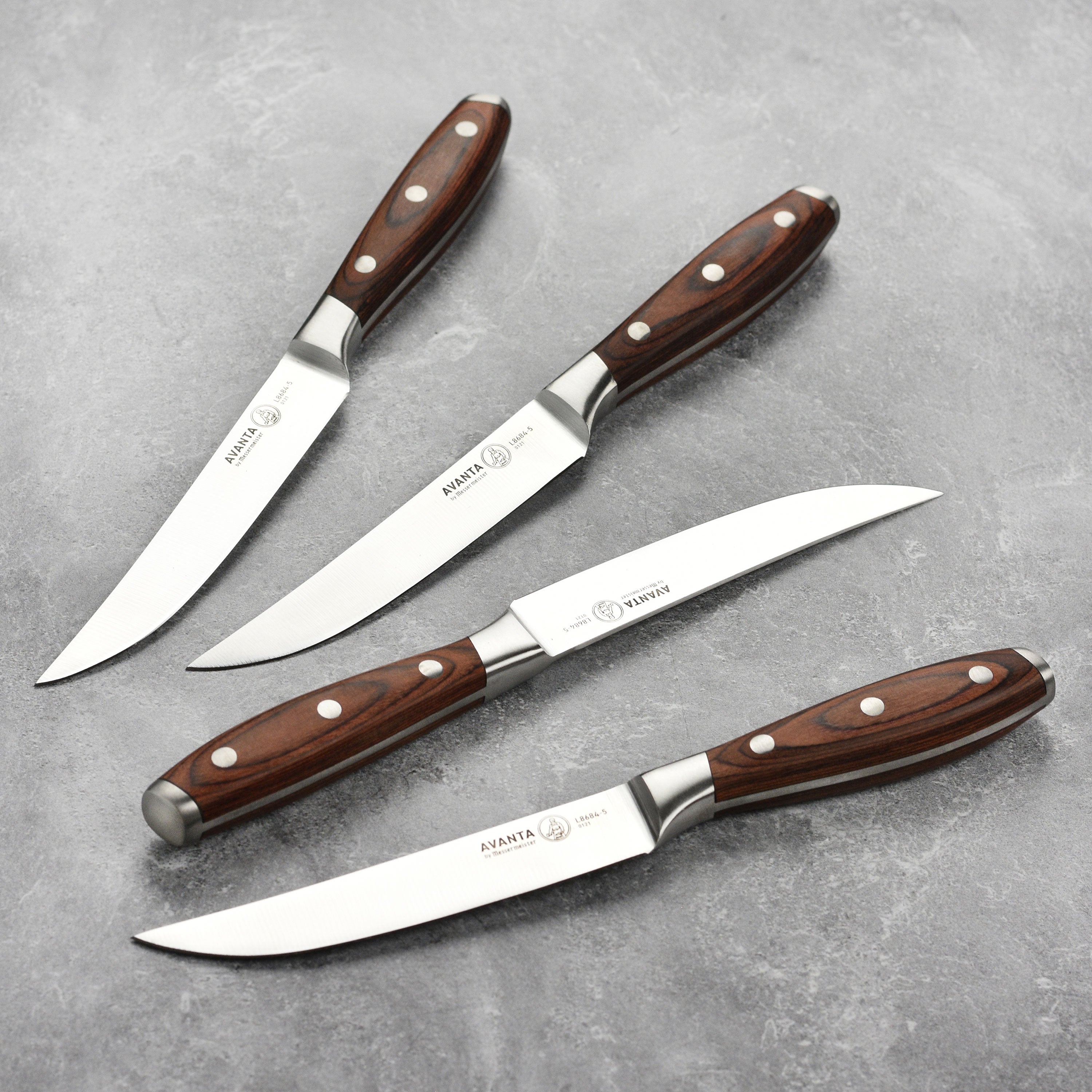 Pakkawood steak knife set showcasing elegant design and sharp blades.