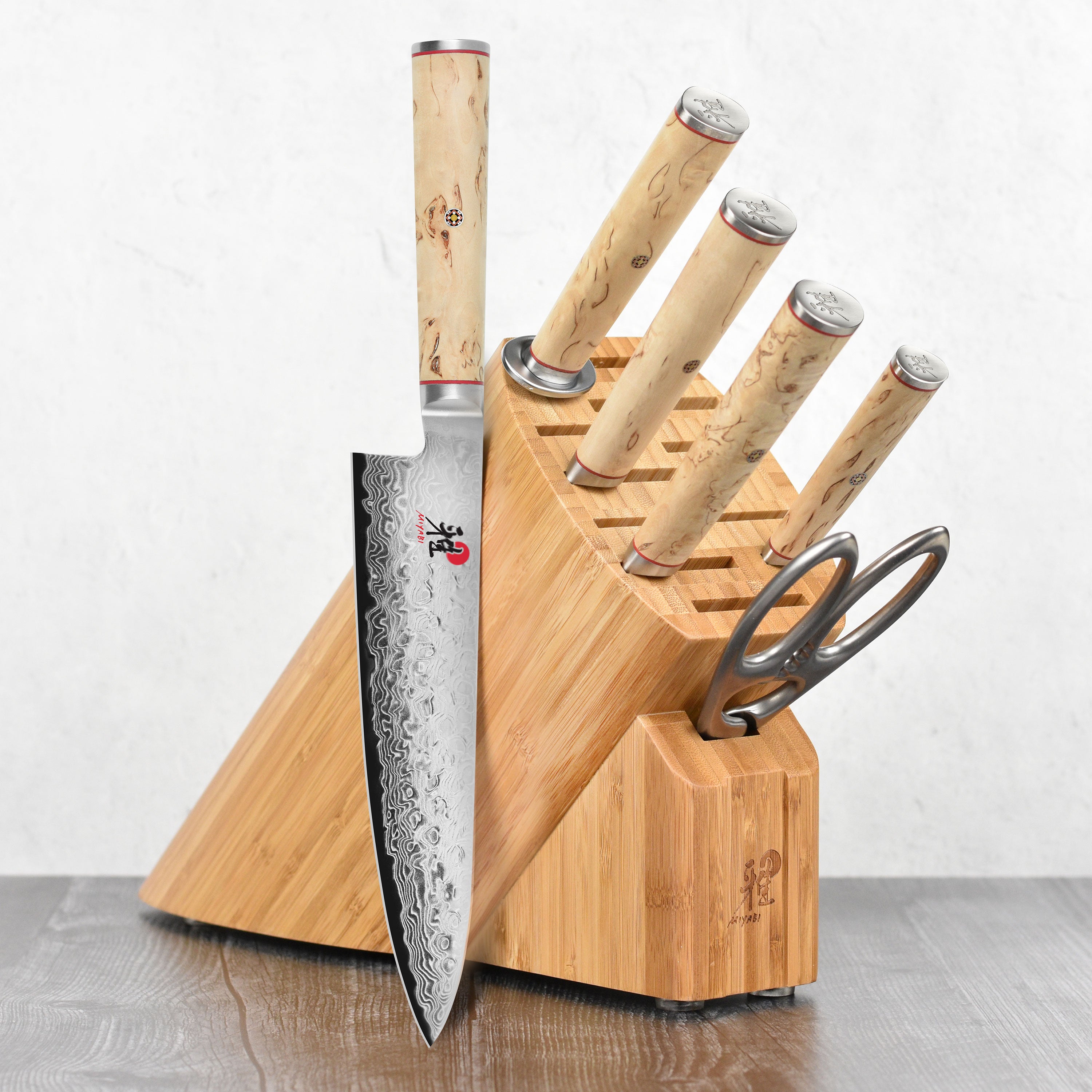 Miyabi Birchwood SG2 7-piece knife set displayed in elegant knife block
