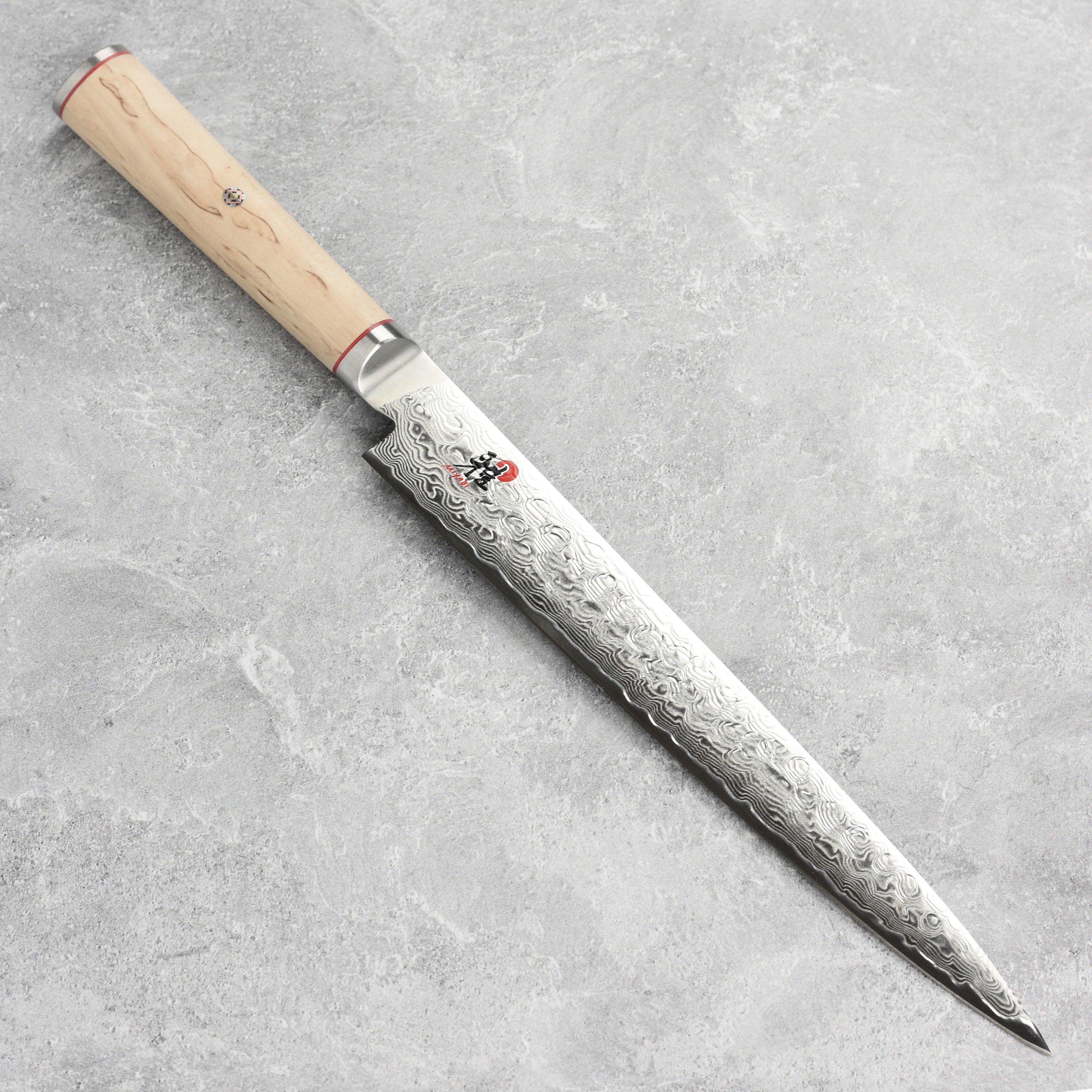 Close-up of the Damascus layered blade on Miyabi Birchwood SG2 slicing knife