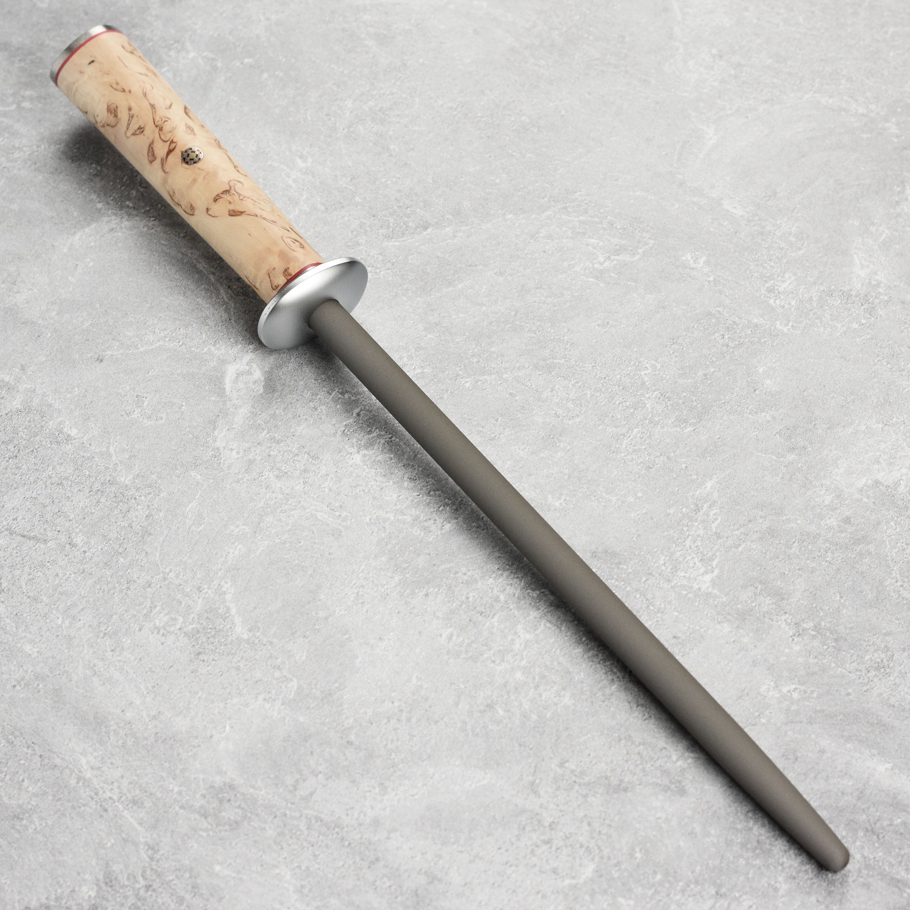 Close-up of the Miyabi Birchwood SG2 tungsten sharpening steel showing the D-shape handle and mosaic pin accent.