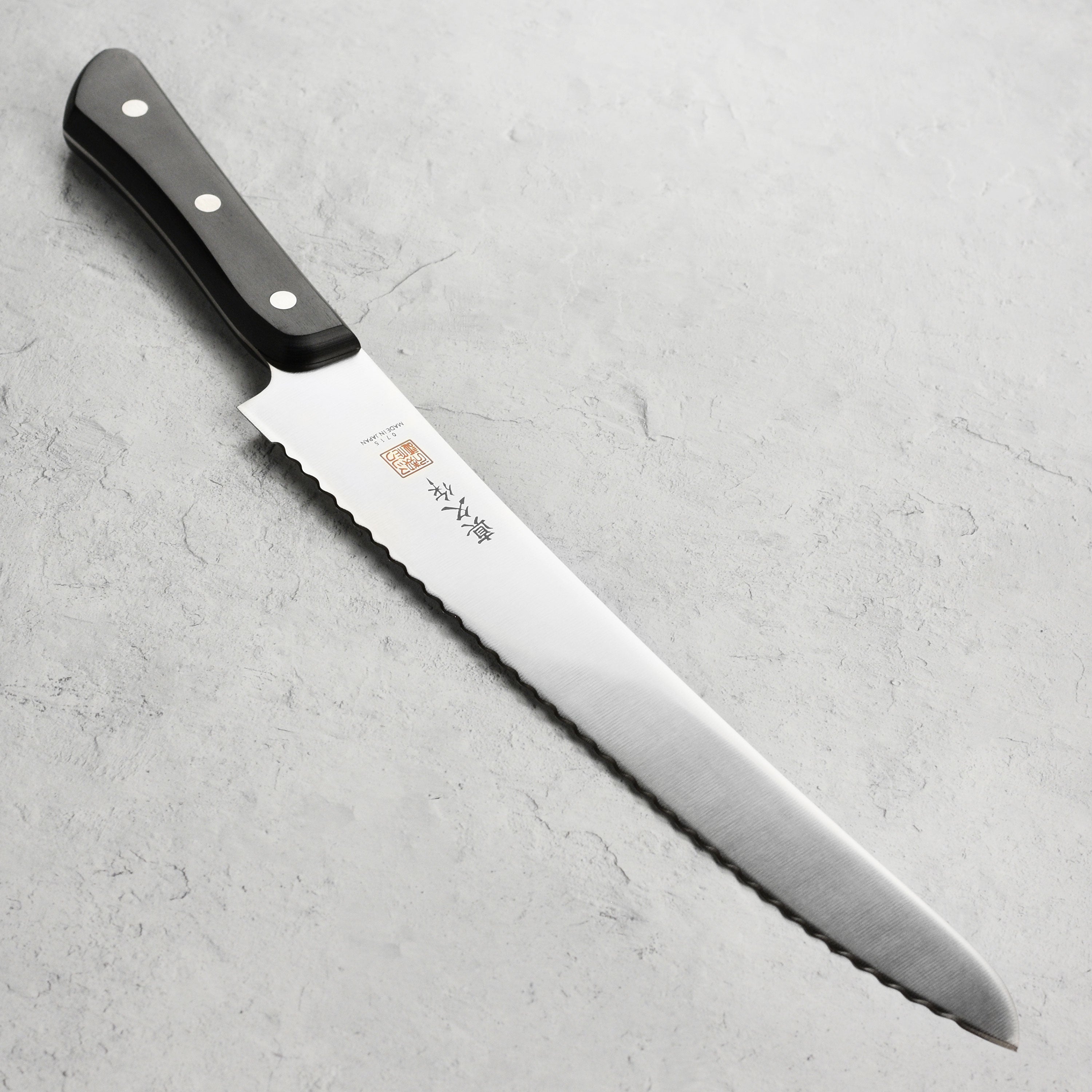 Japanese bread knife with high-carbon blade and Pakkawood handle for precise slicing