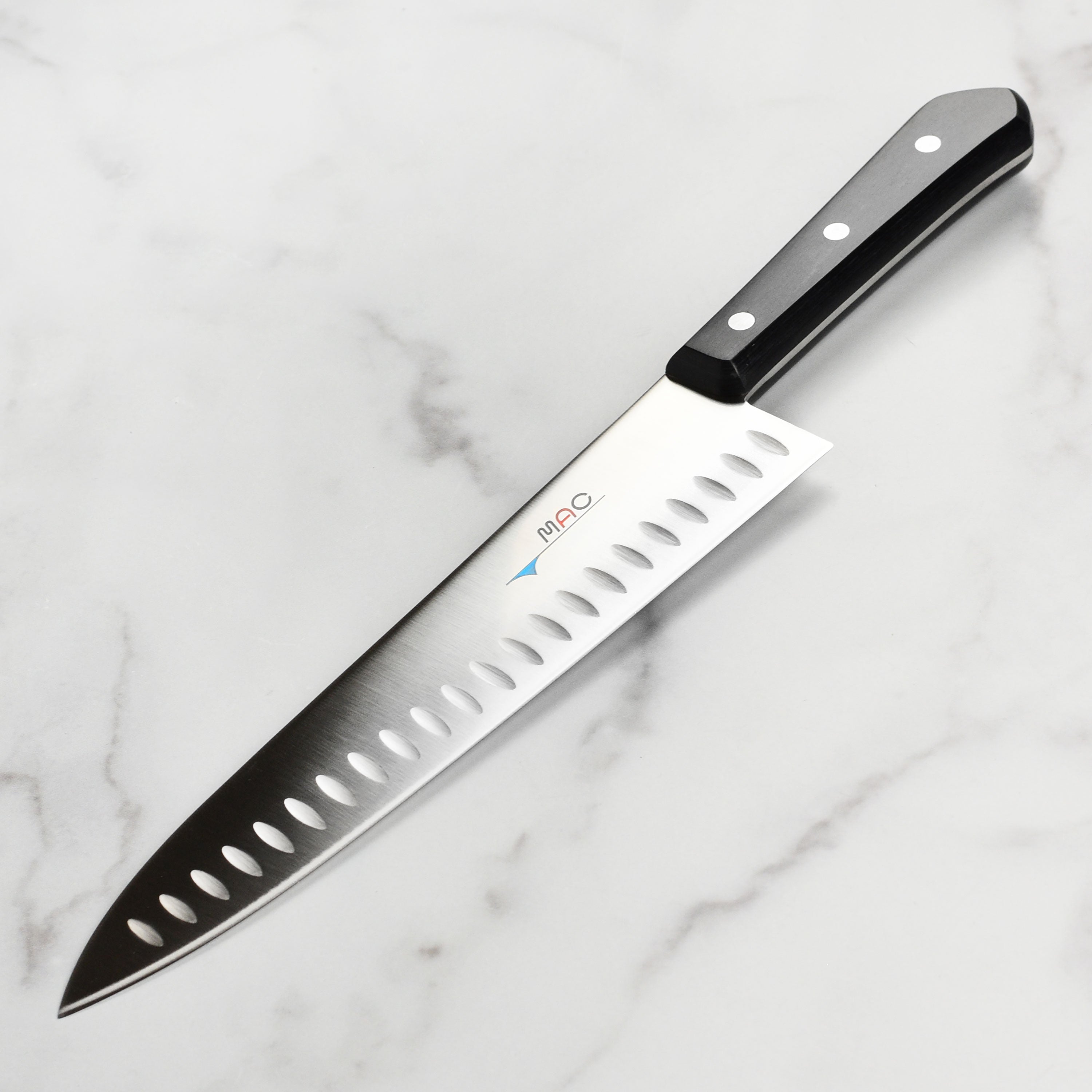 MAC chef knife with hollow edge and high carbon steel blade for precise cutting