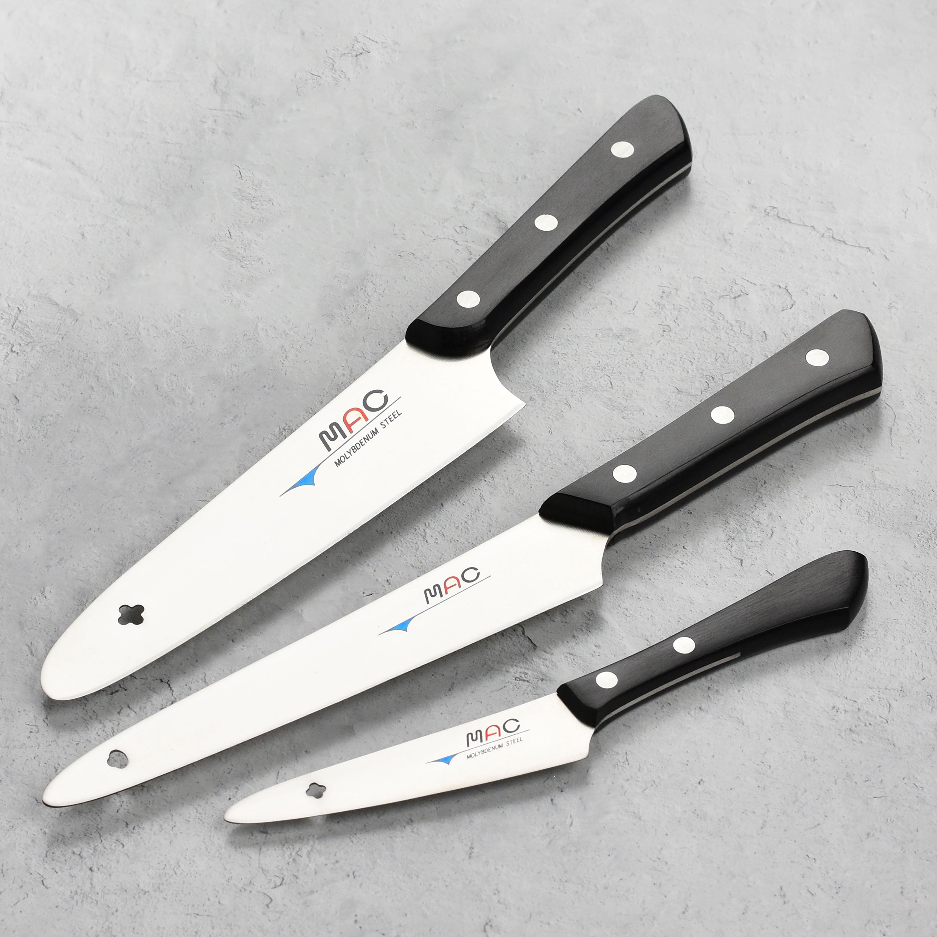 Close-up of the MAC knife set showcasing the sharp blade and Pakkawood handle.