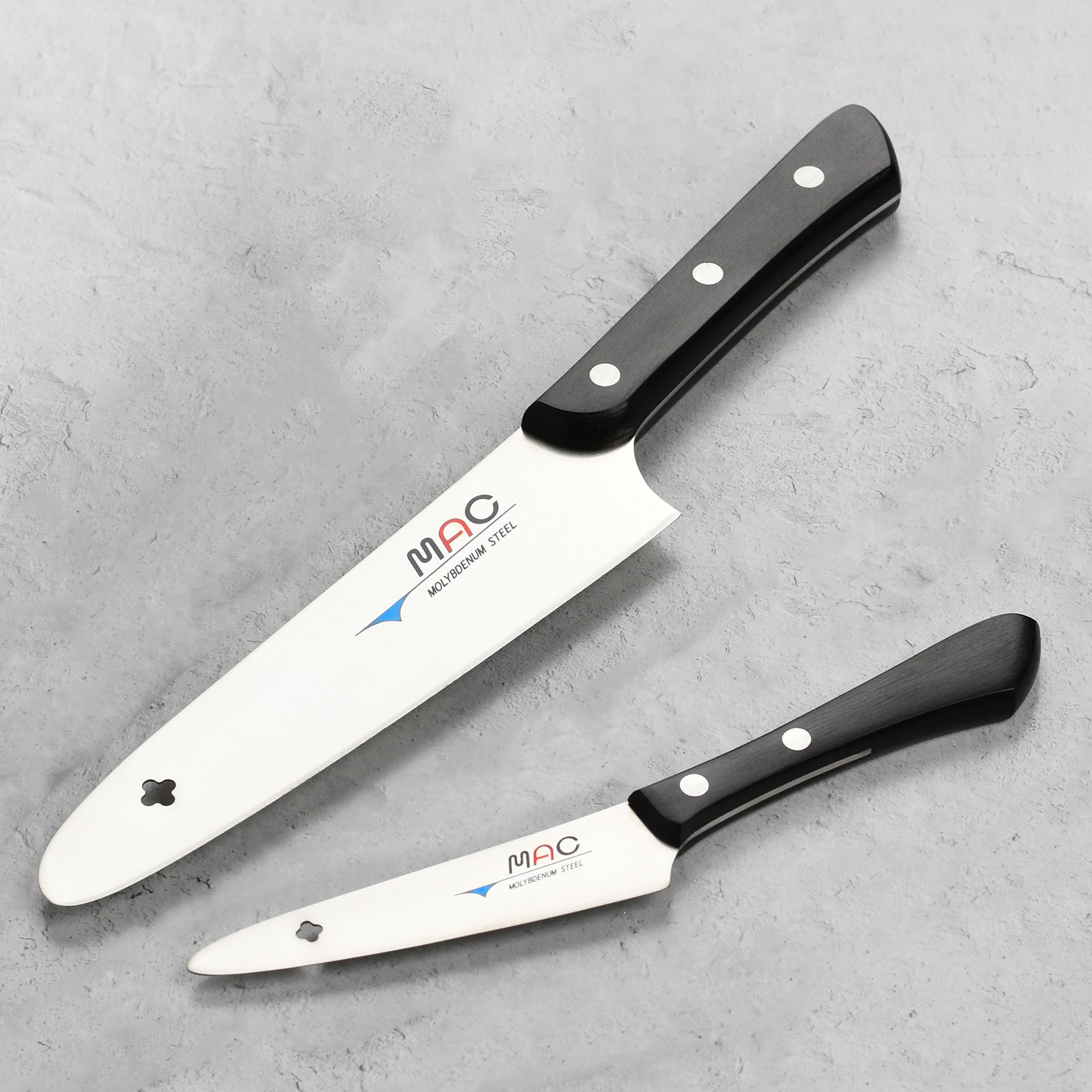Close-up view of the MAC Professional Chef Knife Set highlighting the sharp blade and ergonomic Pakkawood handle.