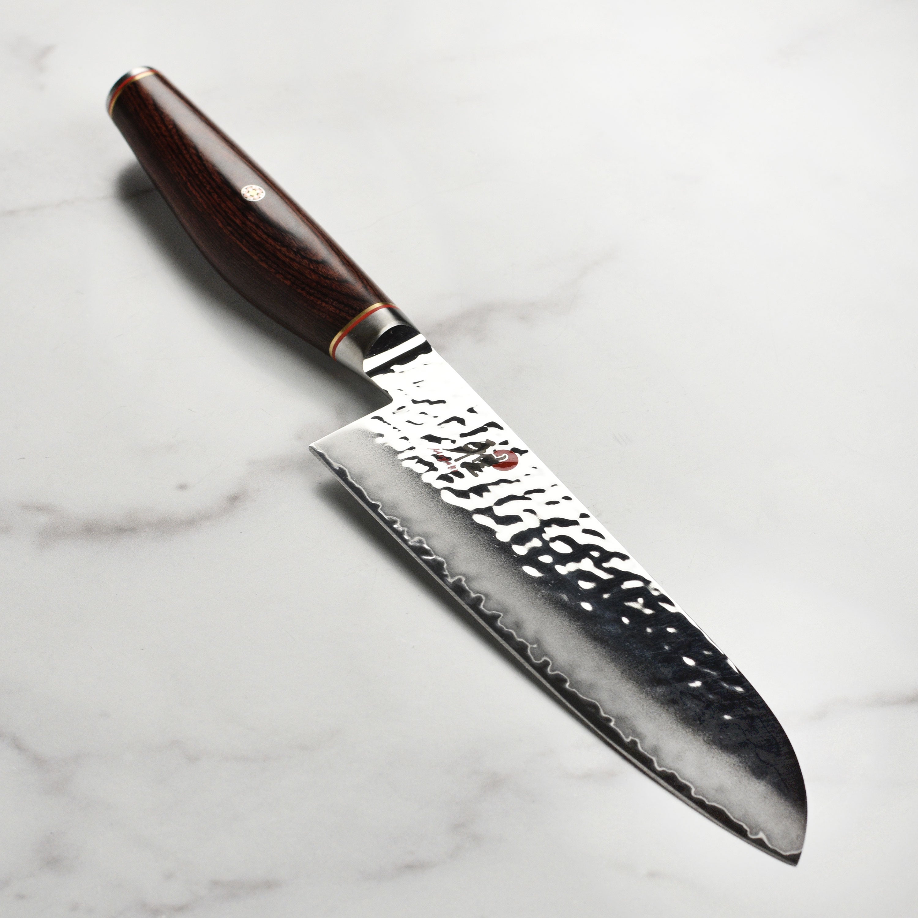 Miyabi Artisan SG2 7-inch Santoku knife with Damascus finish and wooden handle