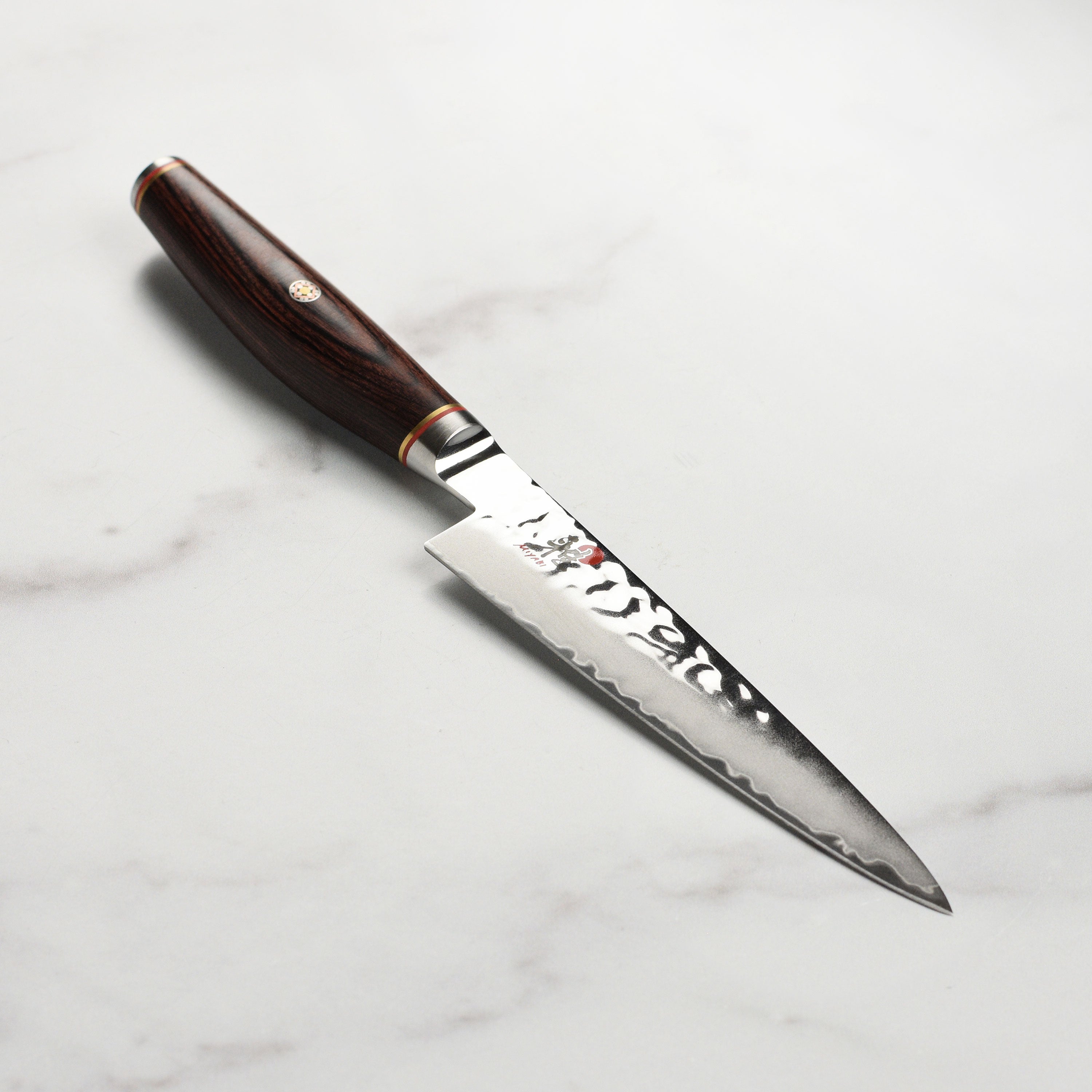 Miyabi Artisan SG2 5-inch utility knife with Damascus finish and Pakkawood handle