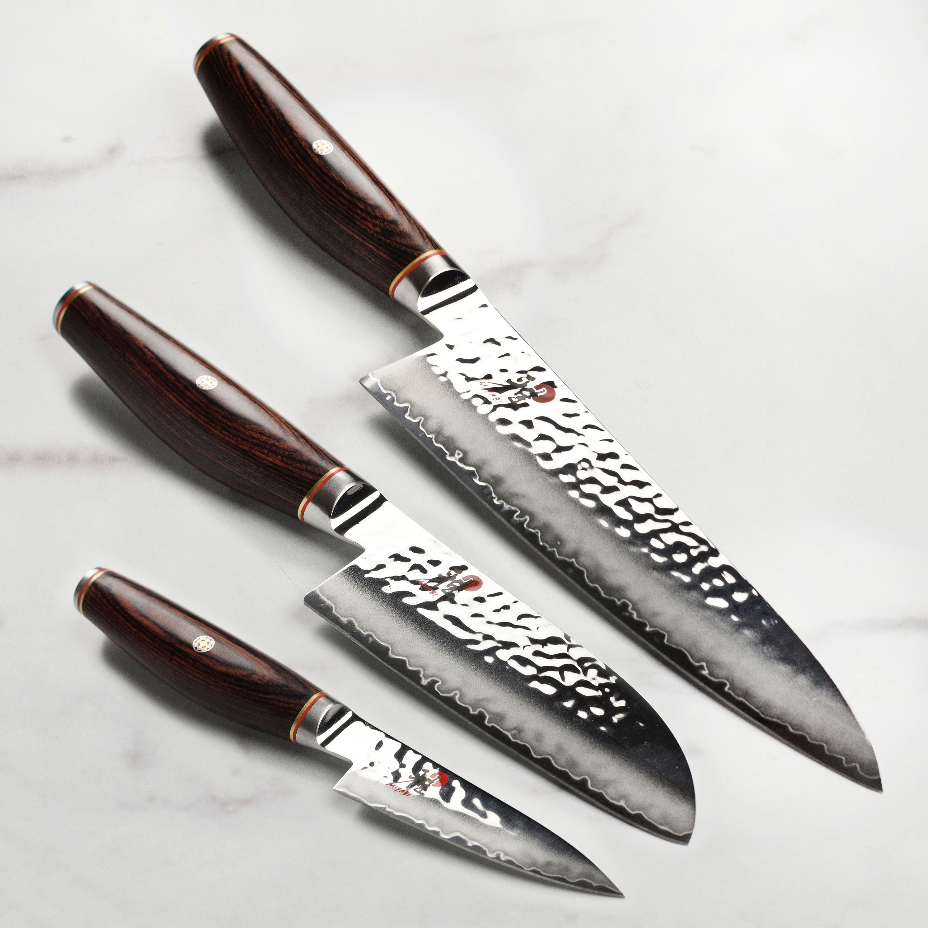 Miyabi Artisan SG2 3-Piece Knife Set showcasing the hammered Damascus texture.