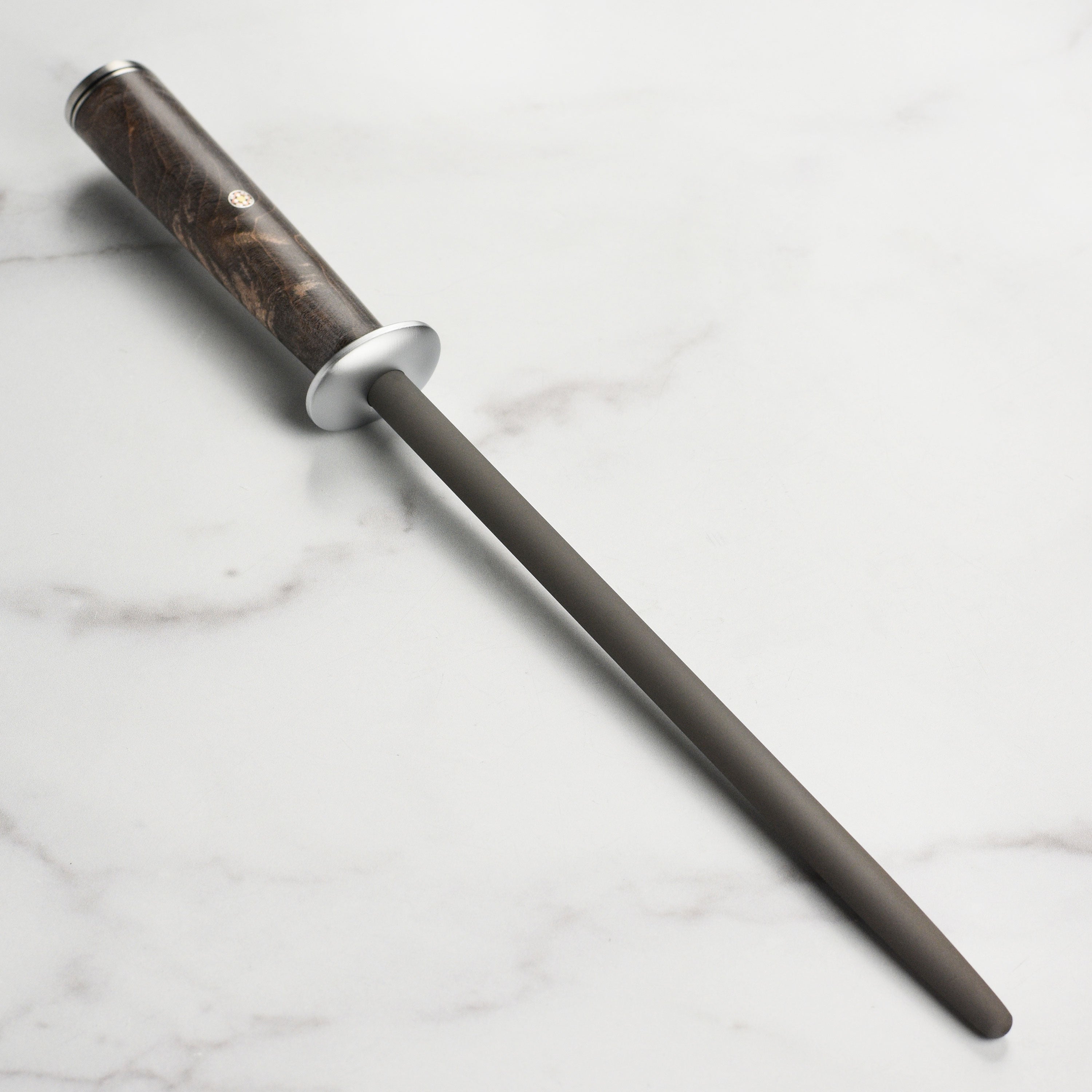 Close-up of Miyabi Black tungsten sharpening steel with D-shaped handle and mosaic pin.