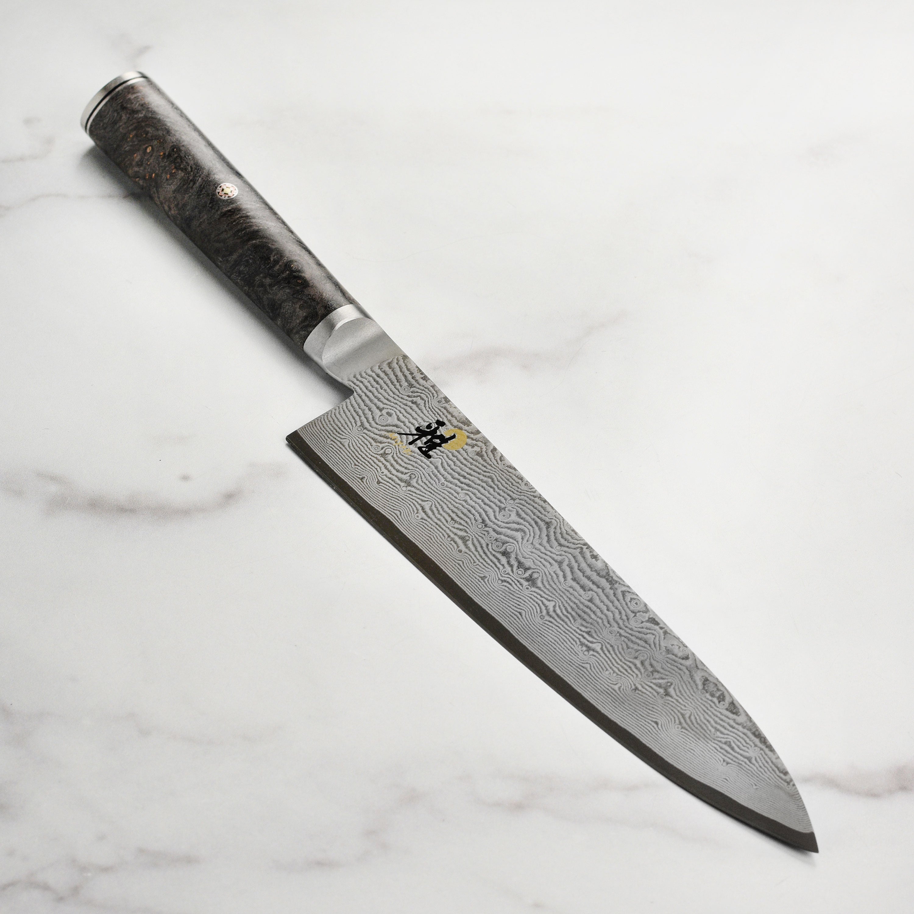 Miyabi Black 8-Inch Chef's Knife with detailed Damascus steel blade and ergonomic handle