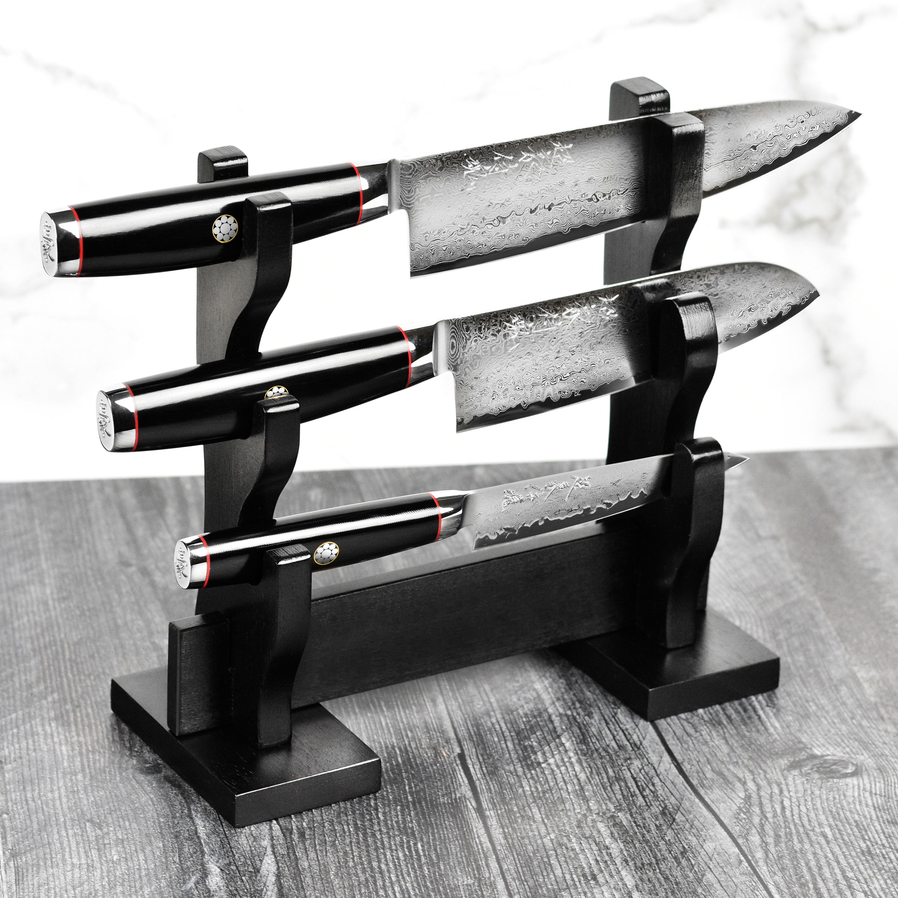 Yaxell Ypsilon SG2 chef knives with layered blades and black micarta handles
