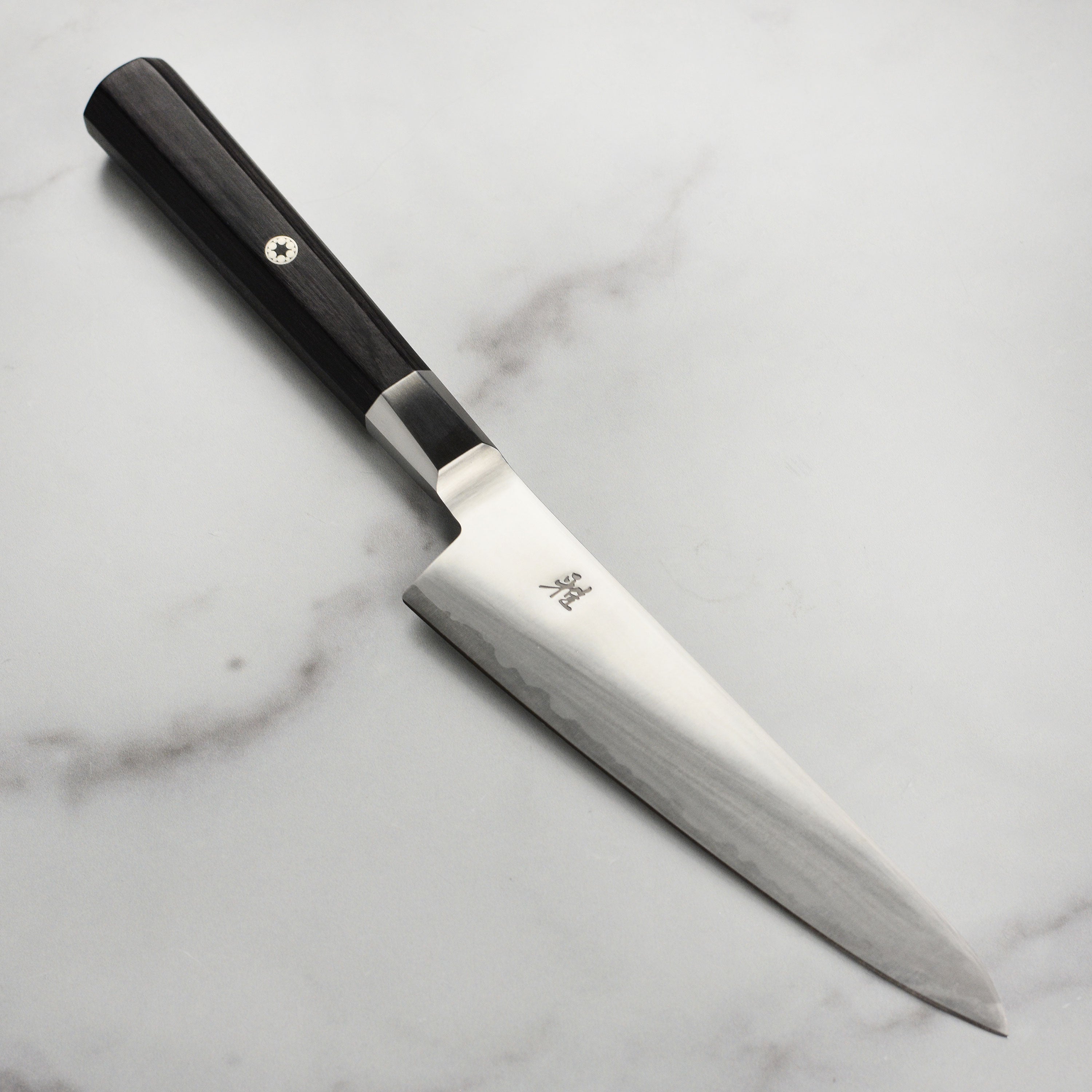 Miyabi Koh 5.5-inch prep knife with detailed blade craftsmanship, ideal for professional kitchens