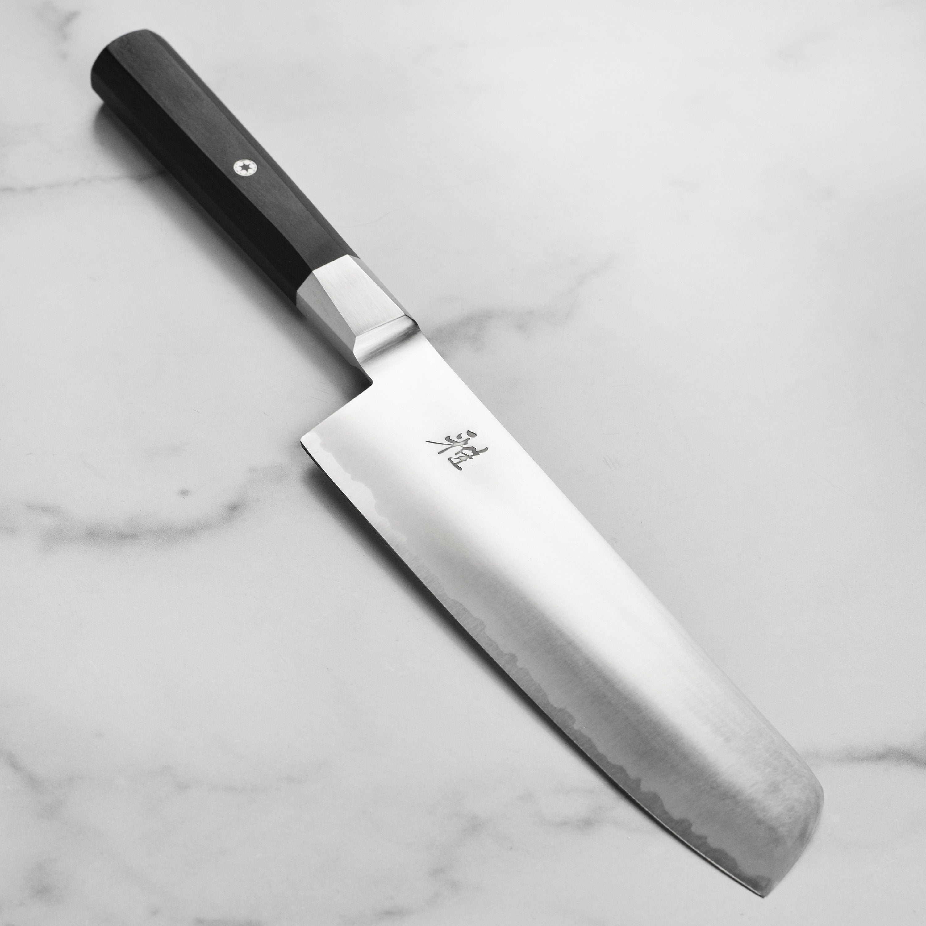 Close-up of the Miyabi Koh Nakiri Knife blade showcasing the sharp edge and fine craftsmanship.