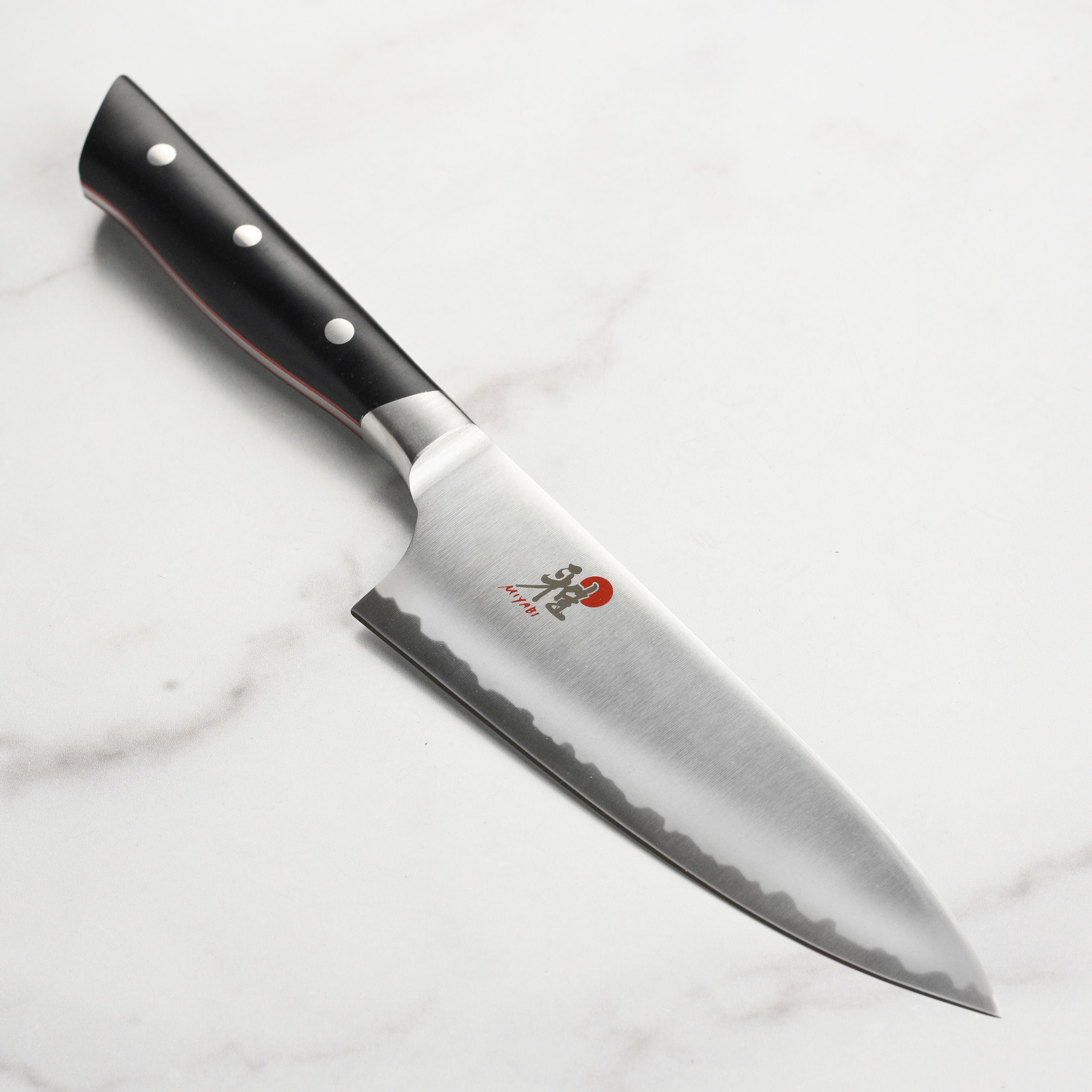 Close-up of the Miyabi knife blade edge, highlighting premium carbide steel and precise 12° angle