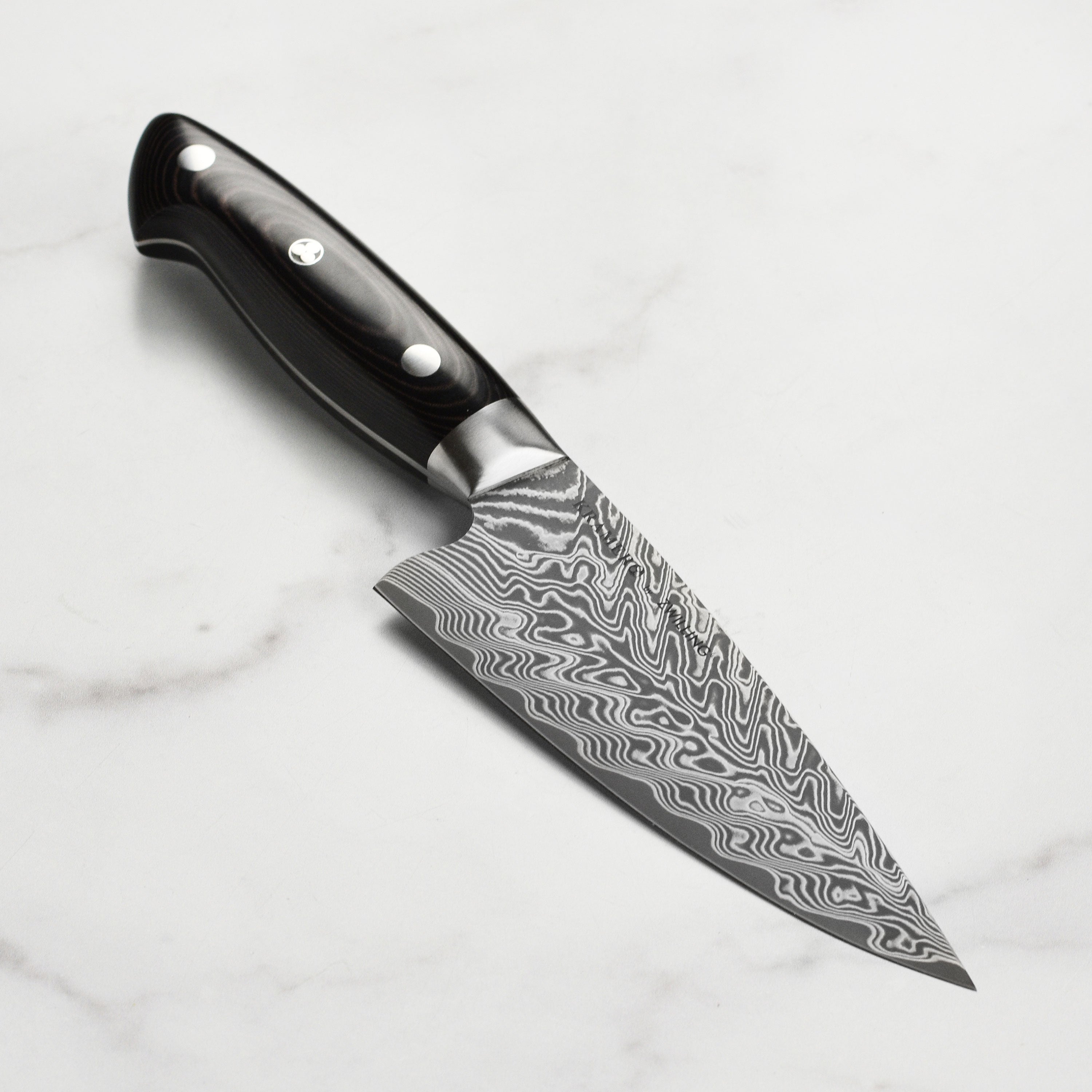 Kramer Damascus chef knife with layered blade and traditional Japanese design