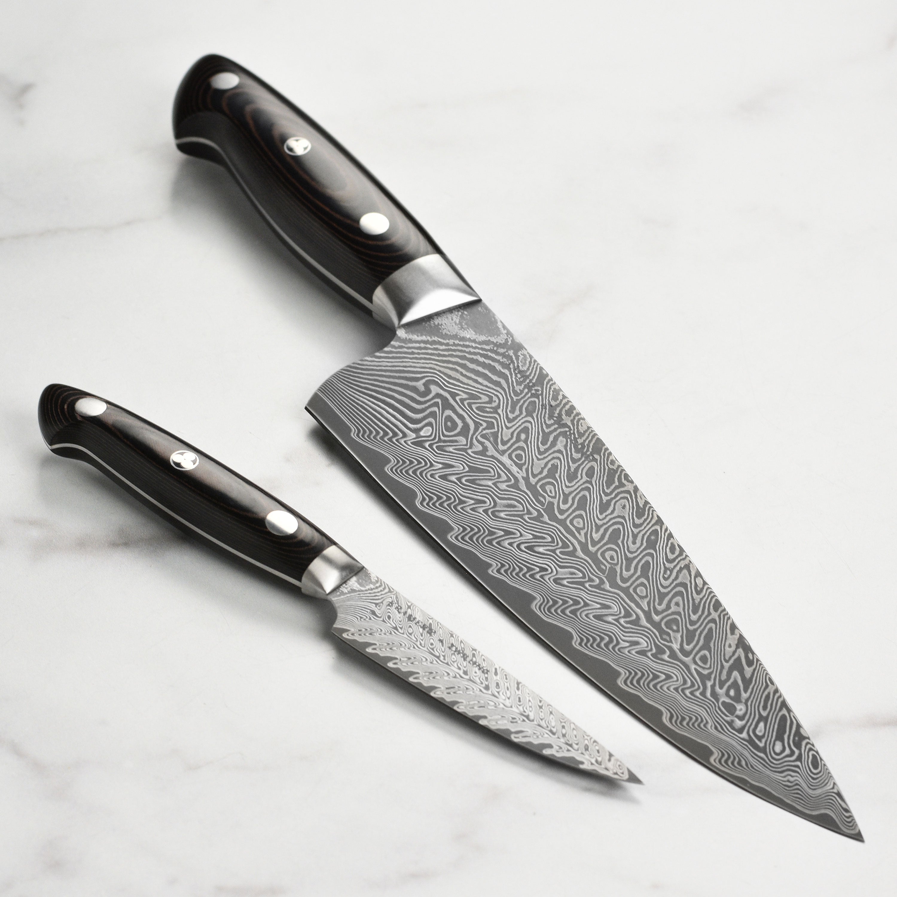 Damascus chef knife with intricate pattern and ergonomic handle