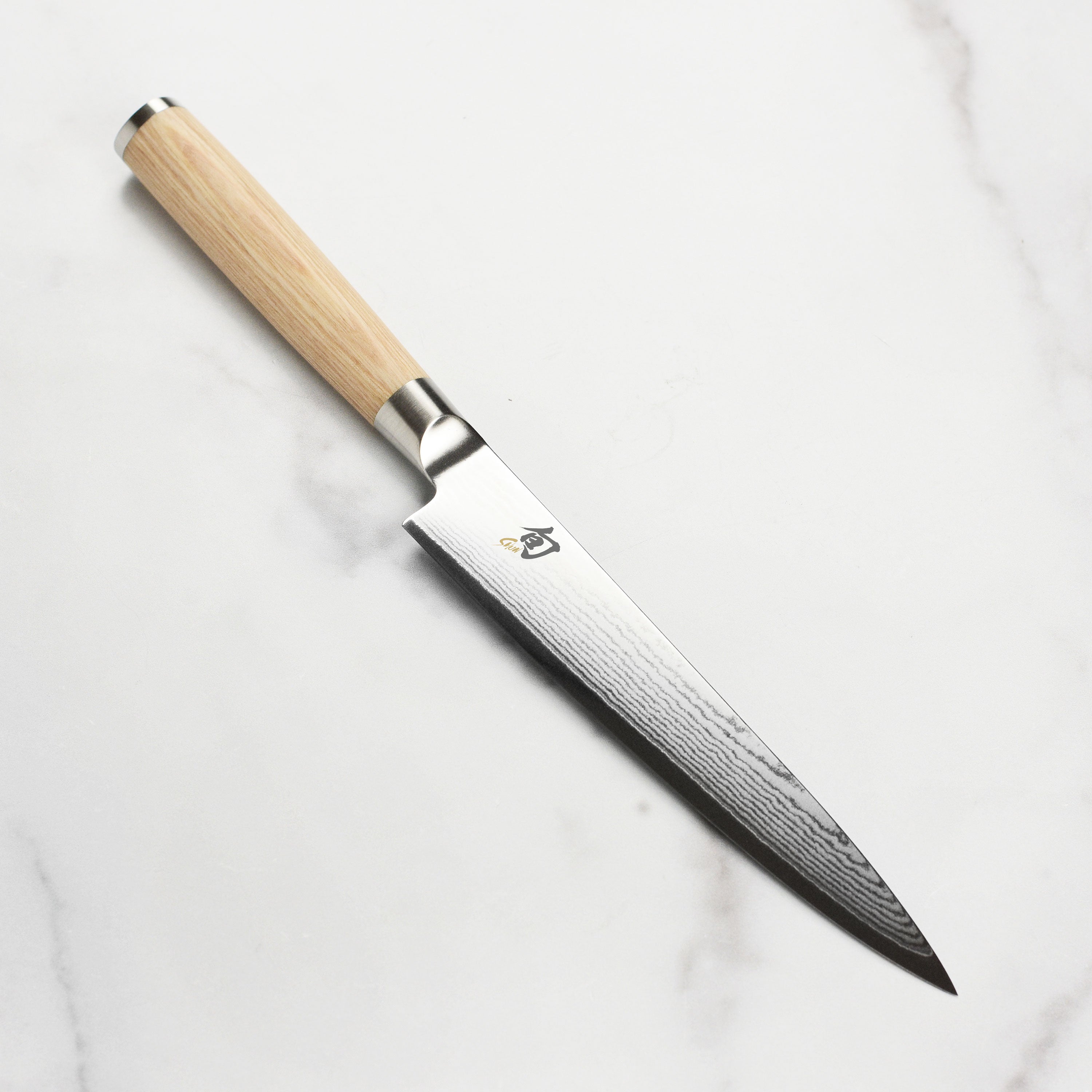 Shun Classic Blonde utility knife with a focus on the blade and handle design.