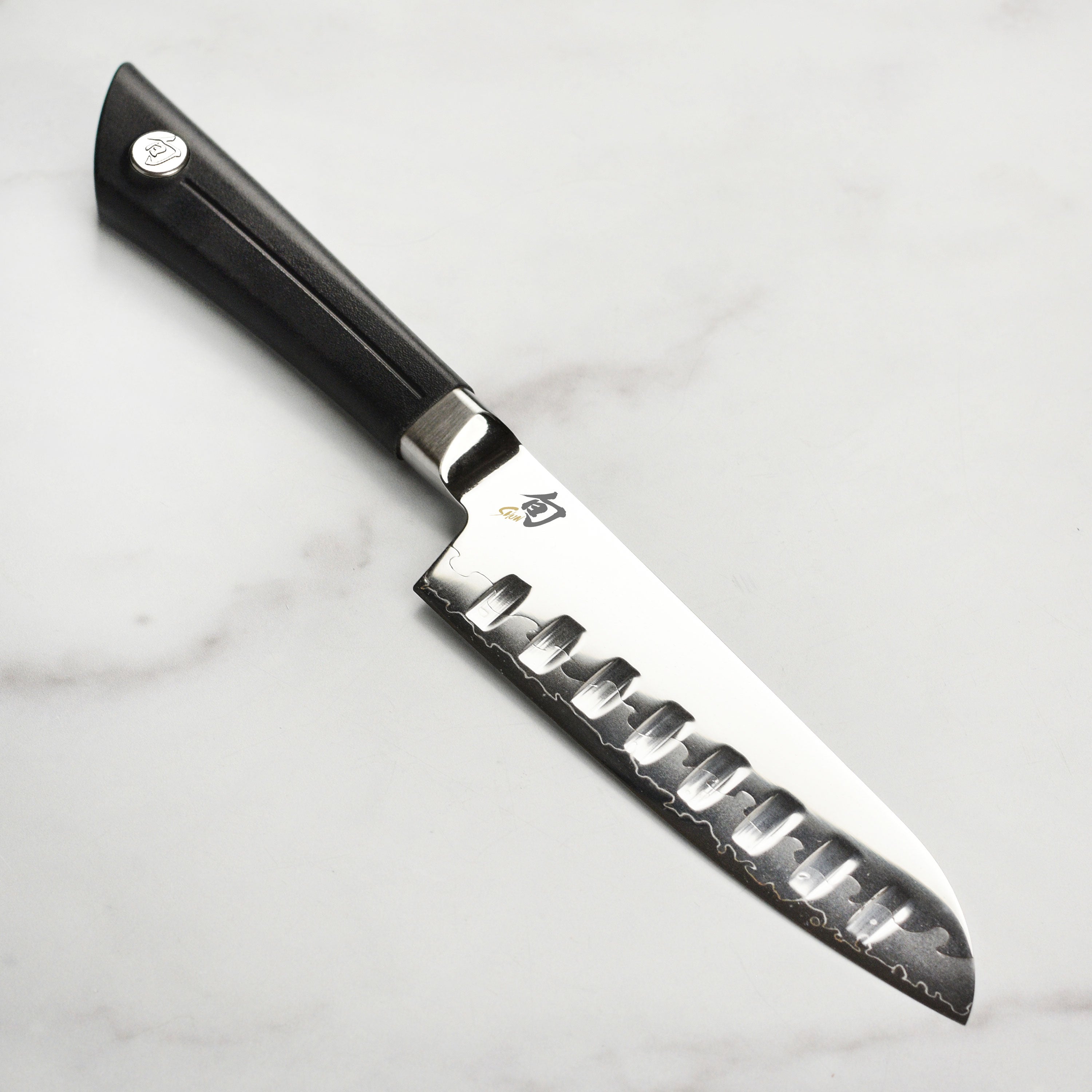Shun Sora 5.5-inch hollow edge Santoku knife with detailed blade pattern