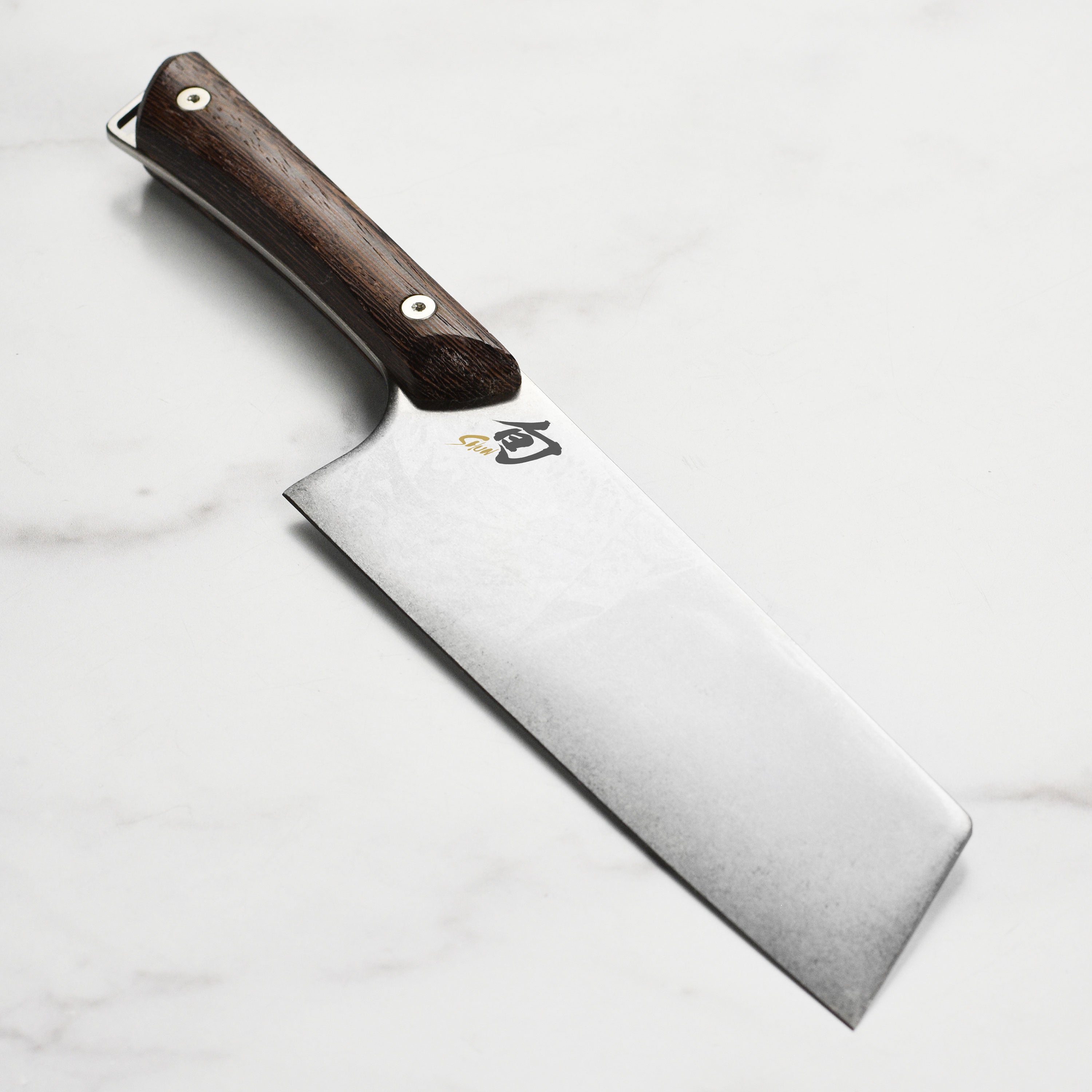 Shun Kanso 7-inch Japanese utility knife with heritage finish blade and dense wooden handle, ideal for home chefs
