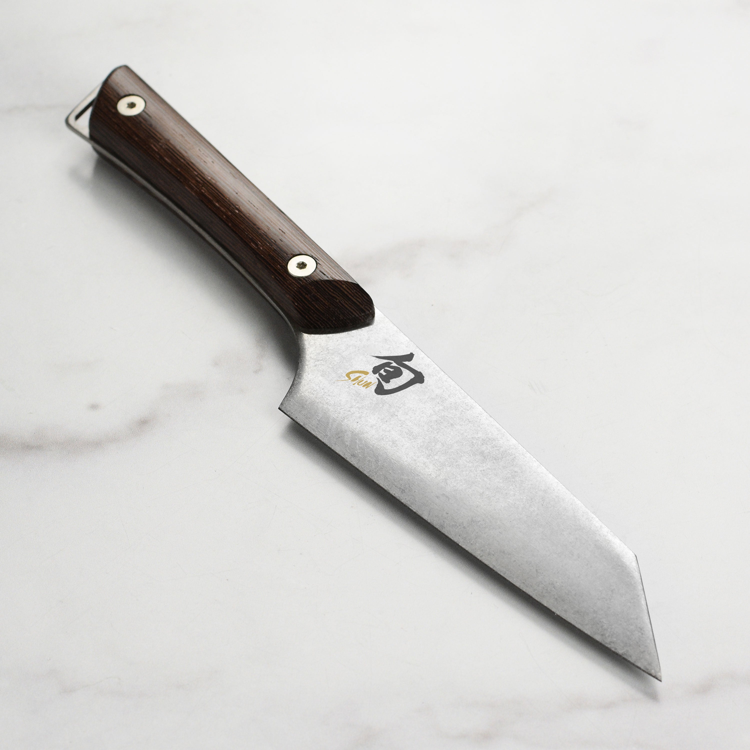 Shun Kanso 5-inch Honesuki knife showcasing its sharp edge and heritage finish
