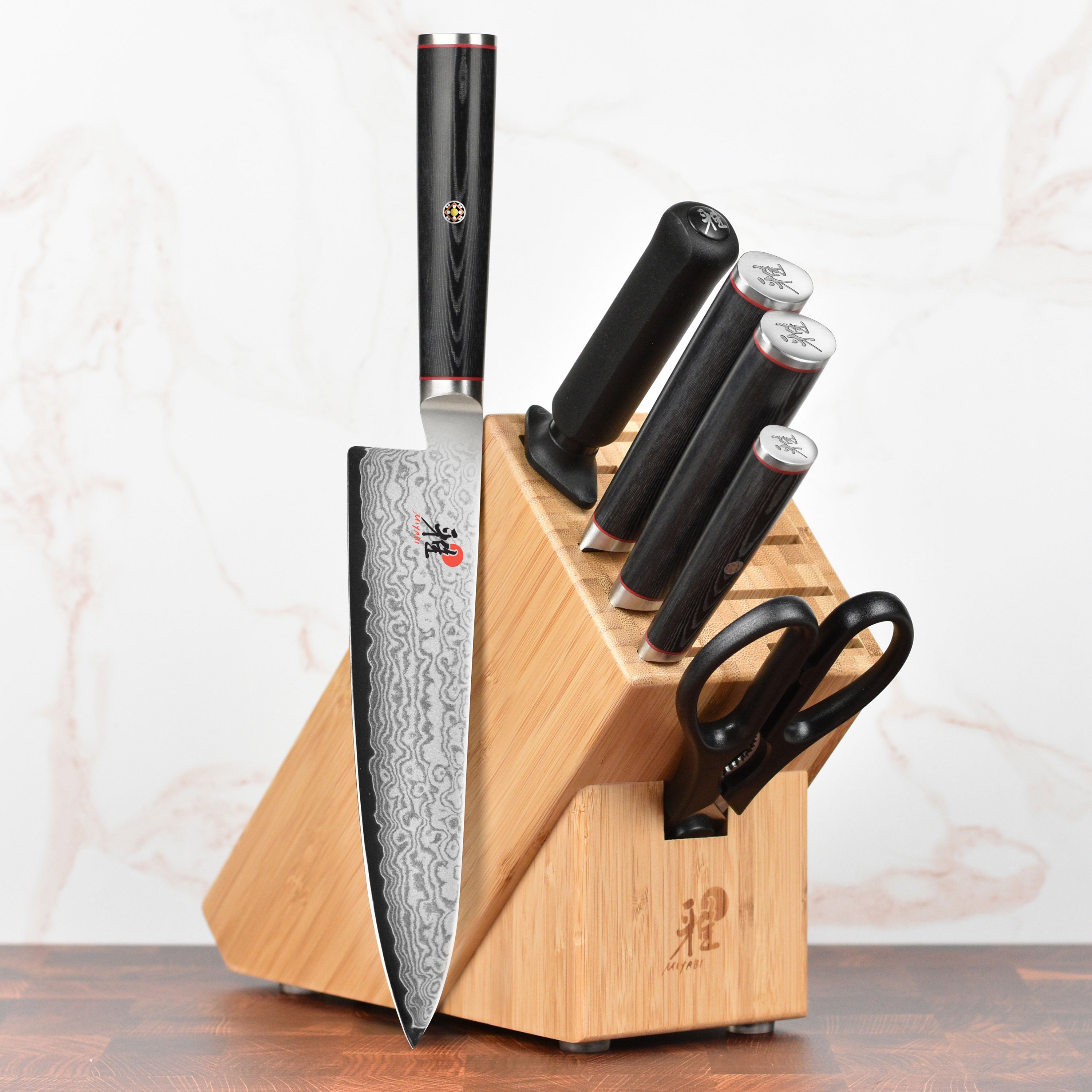 Top view of Miyabi Kaizen Japanese knives displayed in natural wood knife block