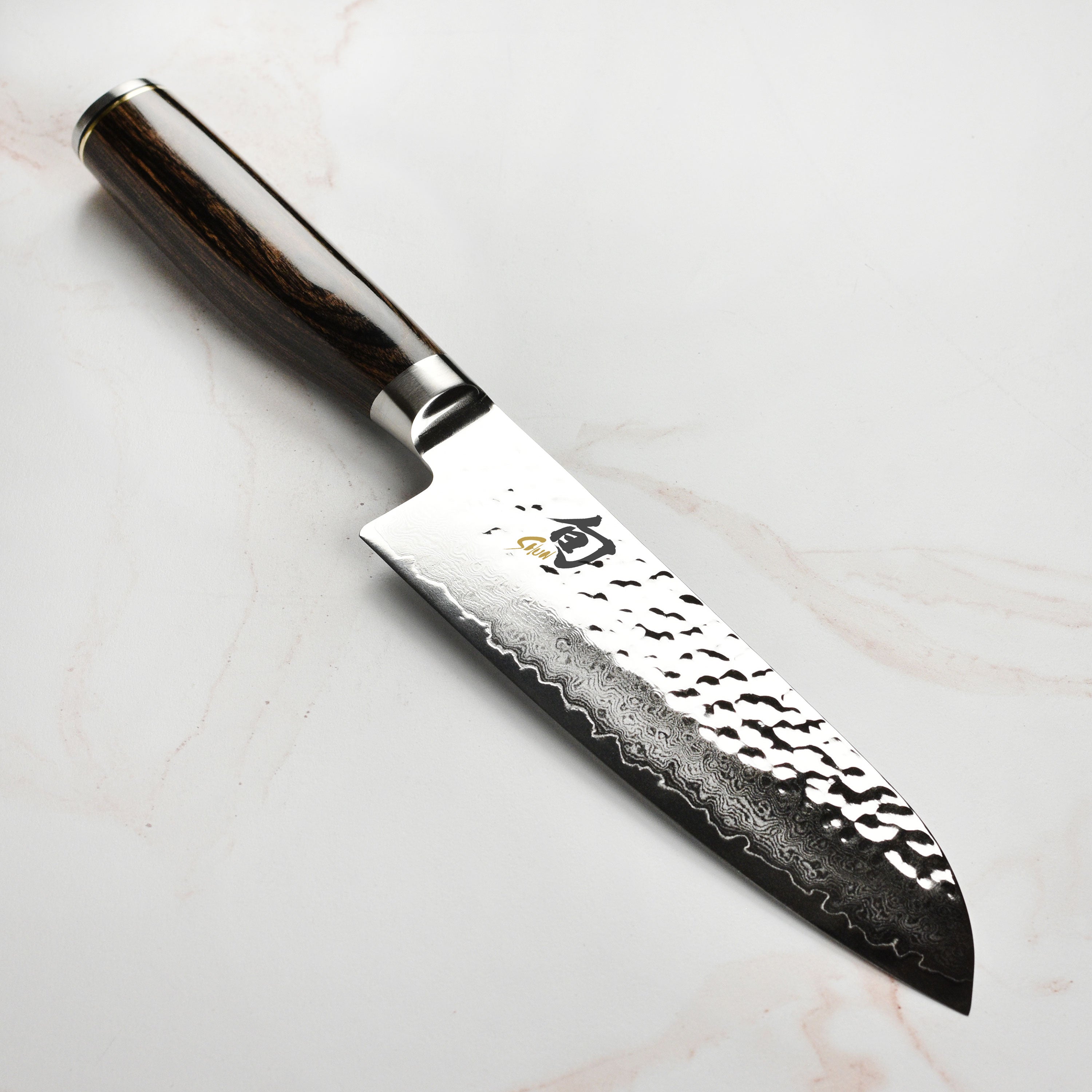Shun Premier Damascus Santoku Knife with layered steel blade and textured finish