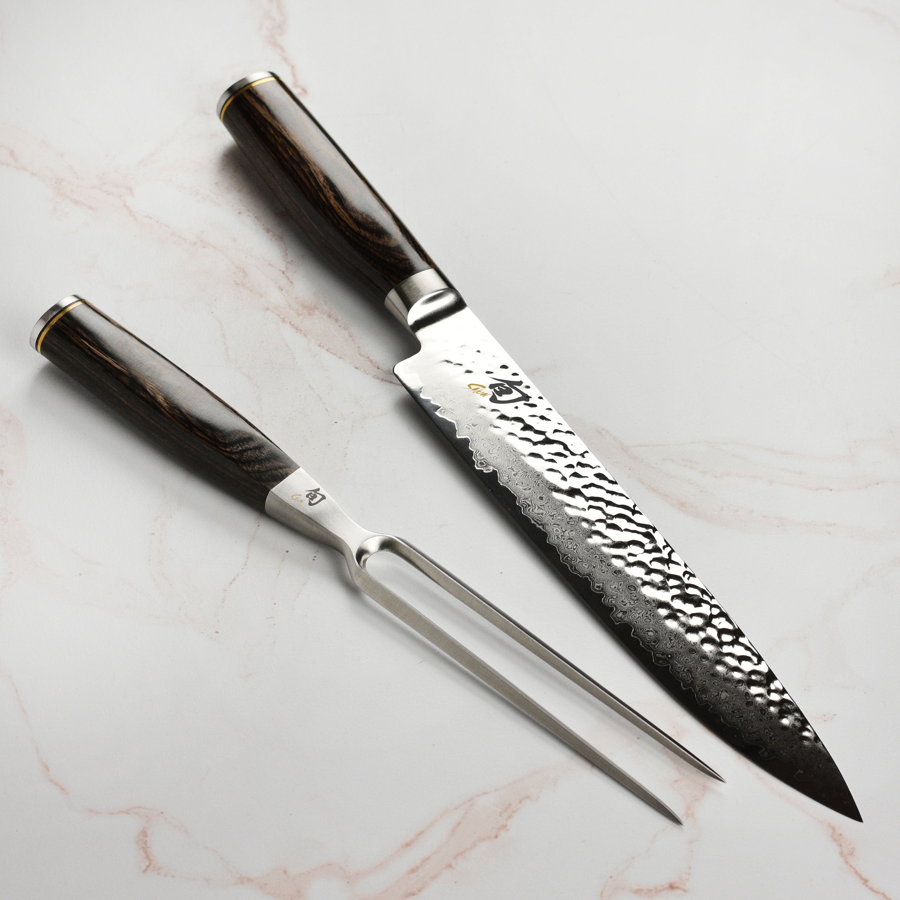 Seki Elite carving knife showcasing its Damascus finish and VG-MAX steel core from an angled view.