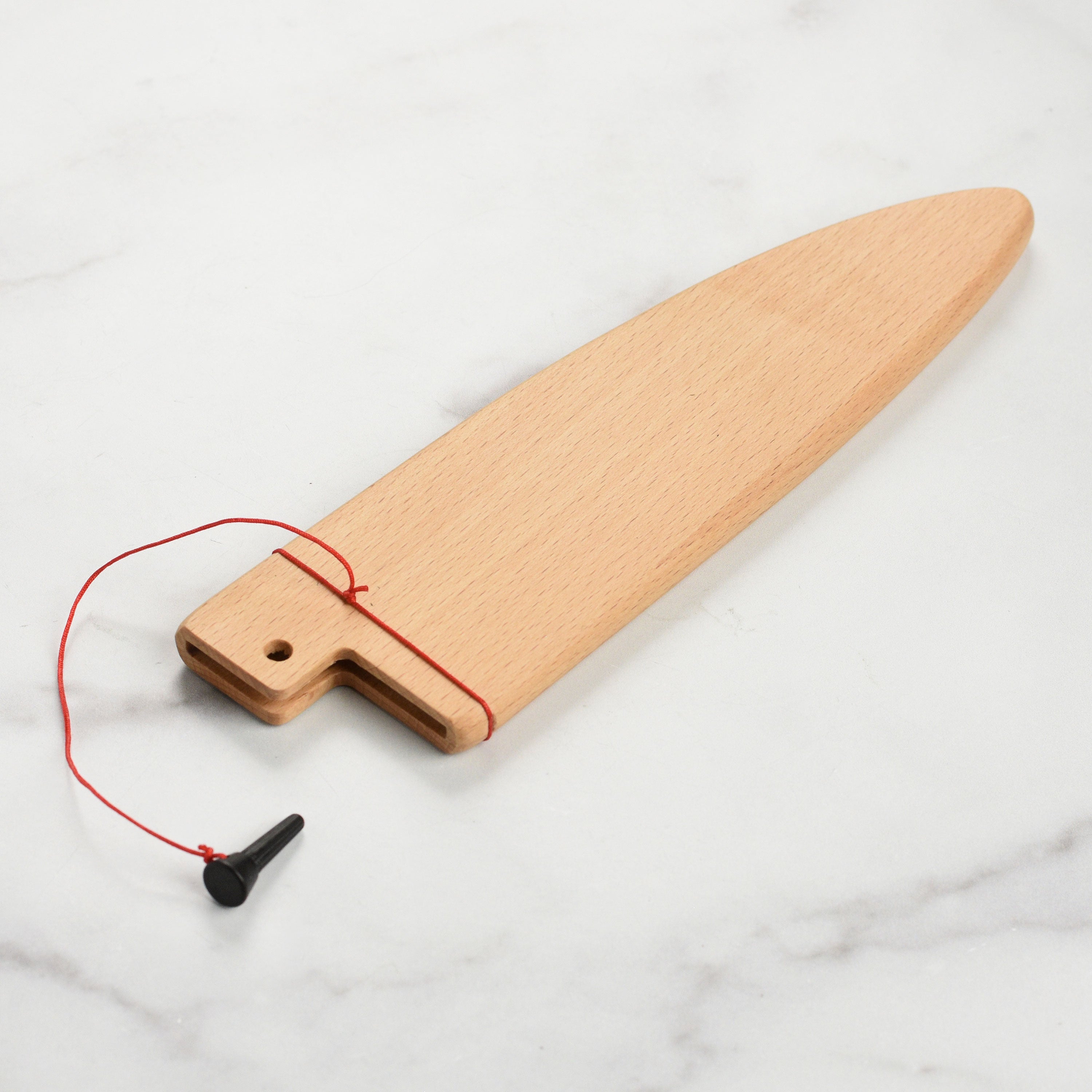 Close-up of wooden knife sheath with locking pin for Shun knives