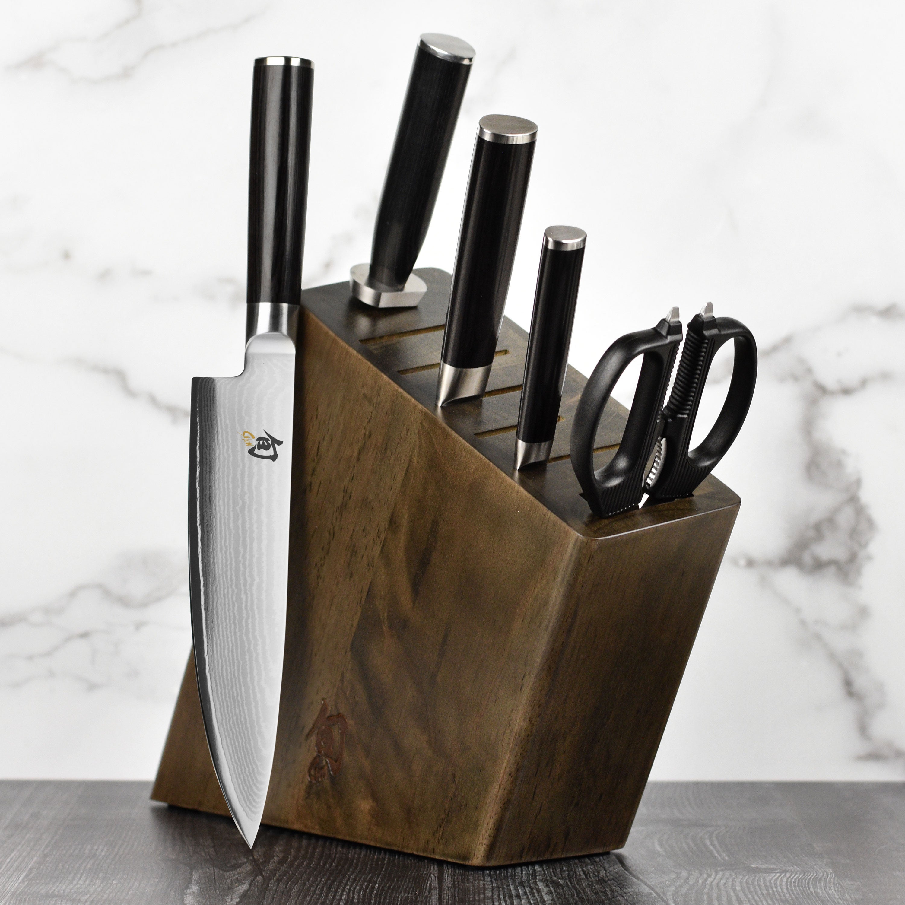 Japanese chef knives arranged in a sleek knife block, highlighting craftsmanship and design