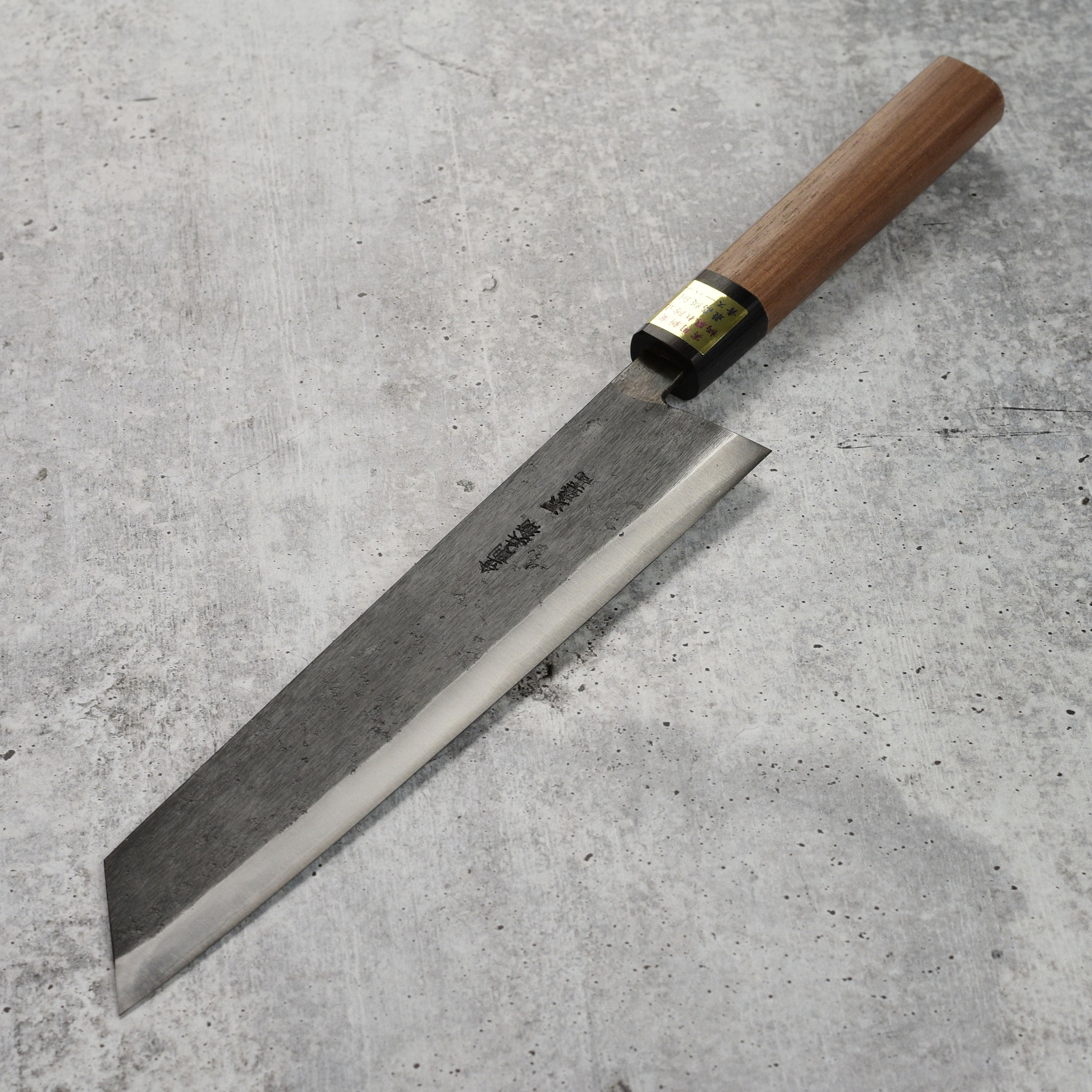 Moritaka Aogami Super Carbon Steel Kiritsuke Knife showing the sharp blade and elegant handle.