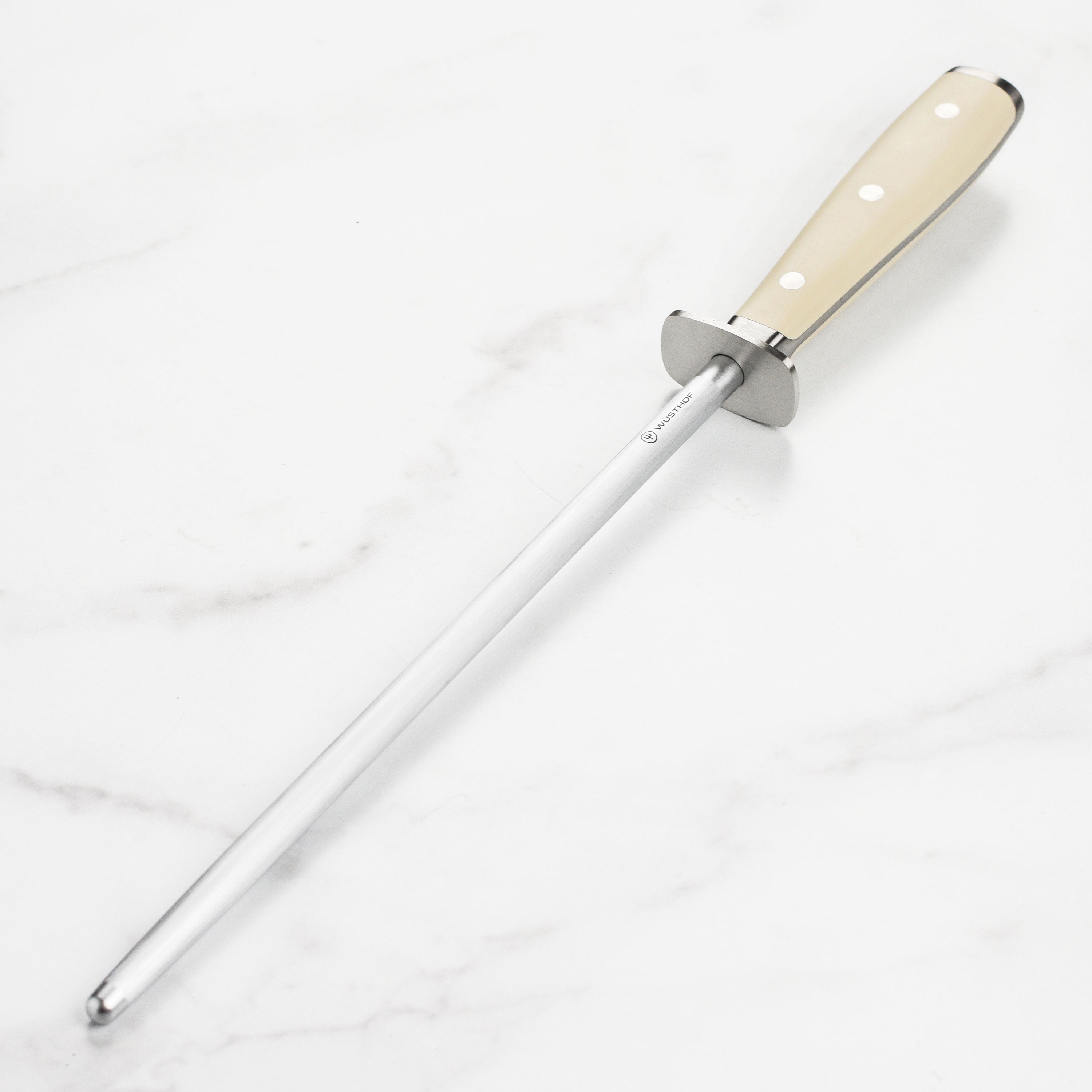 Wusthof Classic honing steel held in a chef's hand, showcasing its ergonomic handle and length.