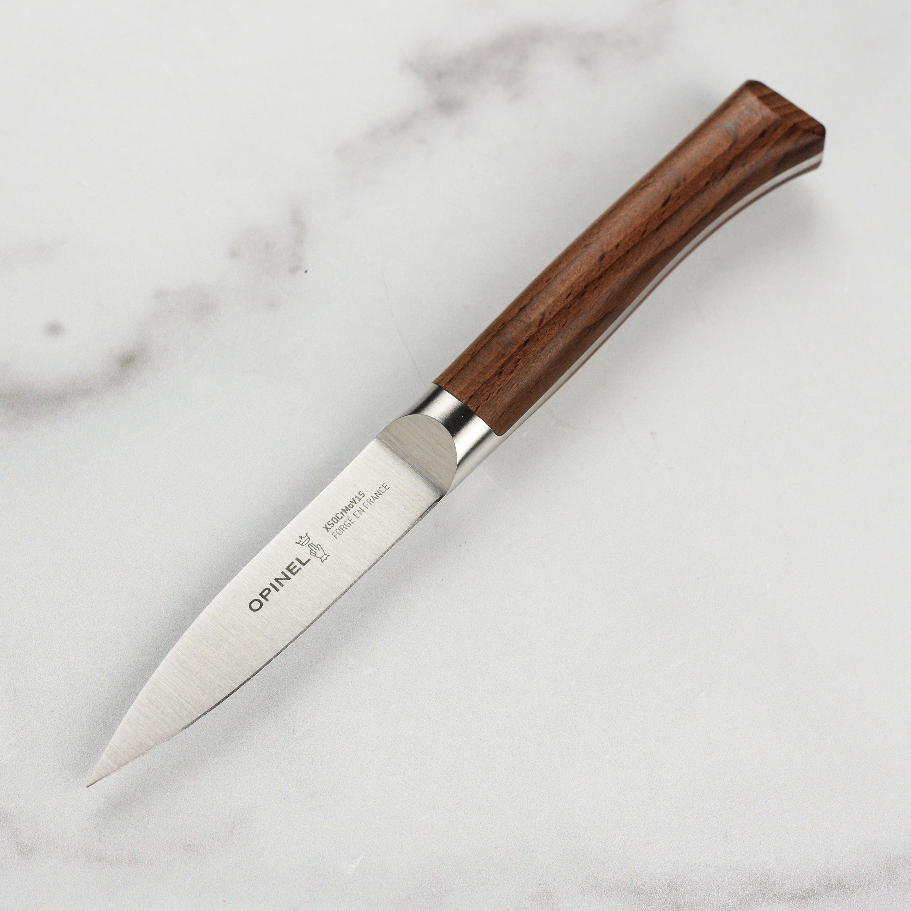 Elegant French forged paring knife showcasing its ergonomic handle.