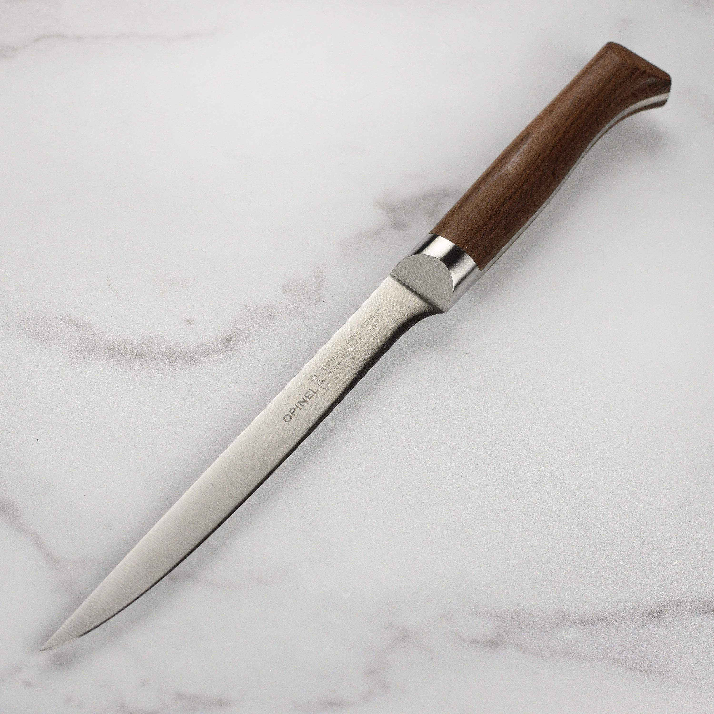 Close-up of the forged stainless steel blade with ergonomic handle