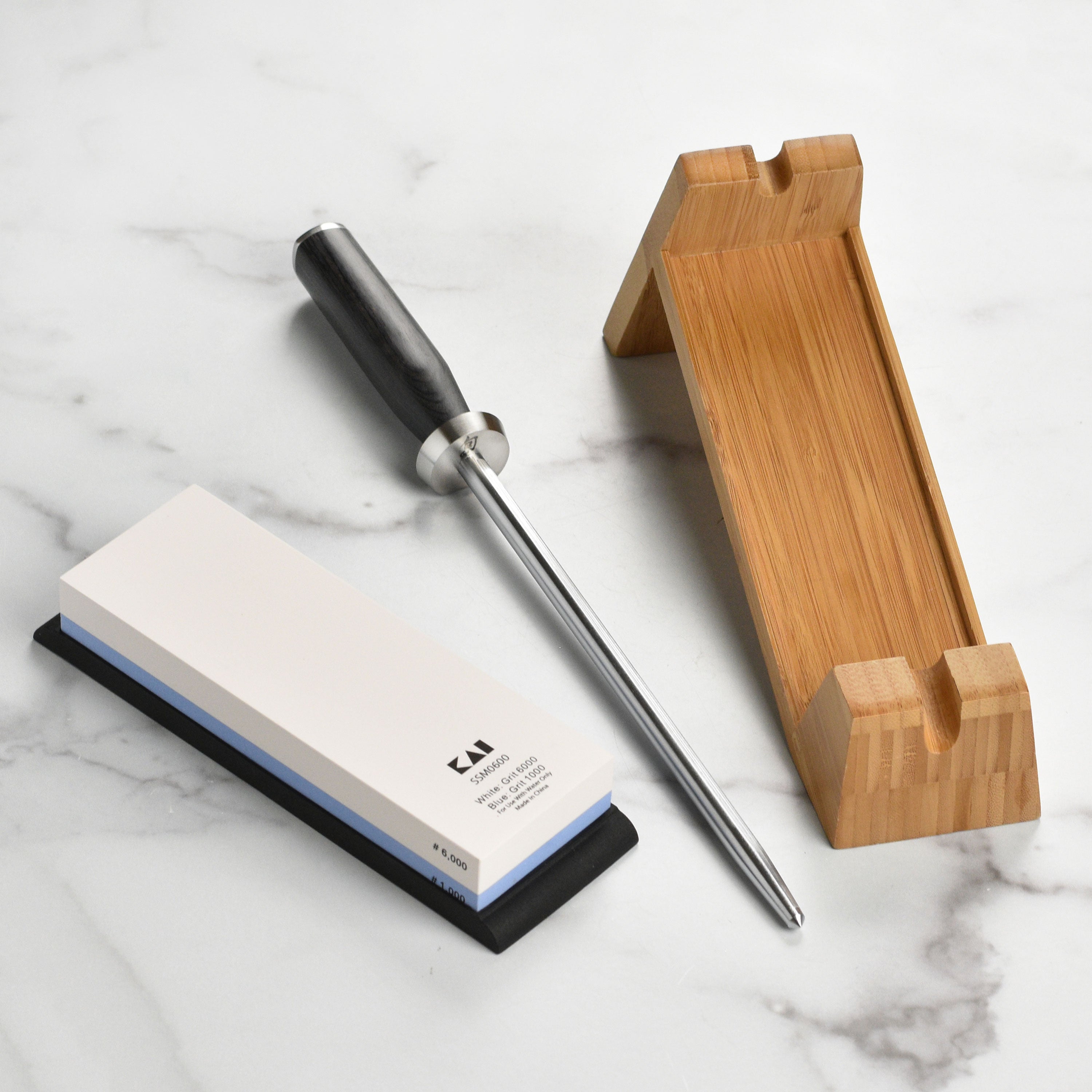 Shun Professional 3-Piece Knife Sharpening System with whetstone and bamboo stand.