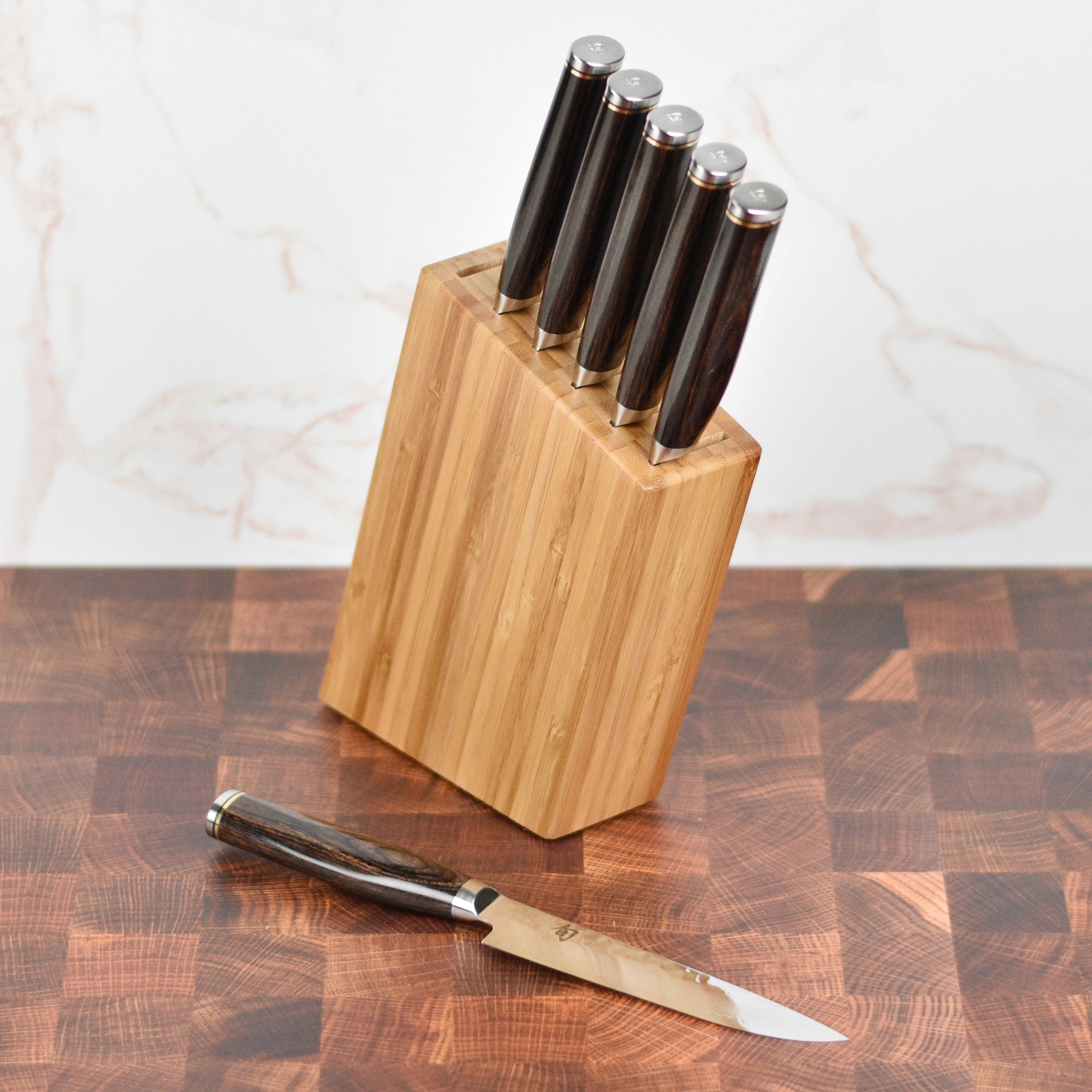 Close-up of Seki Master steak knife highlighting its Damascus steel layers.