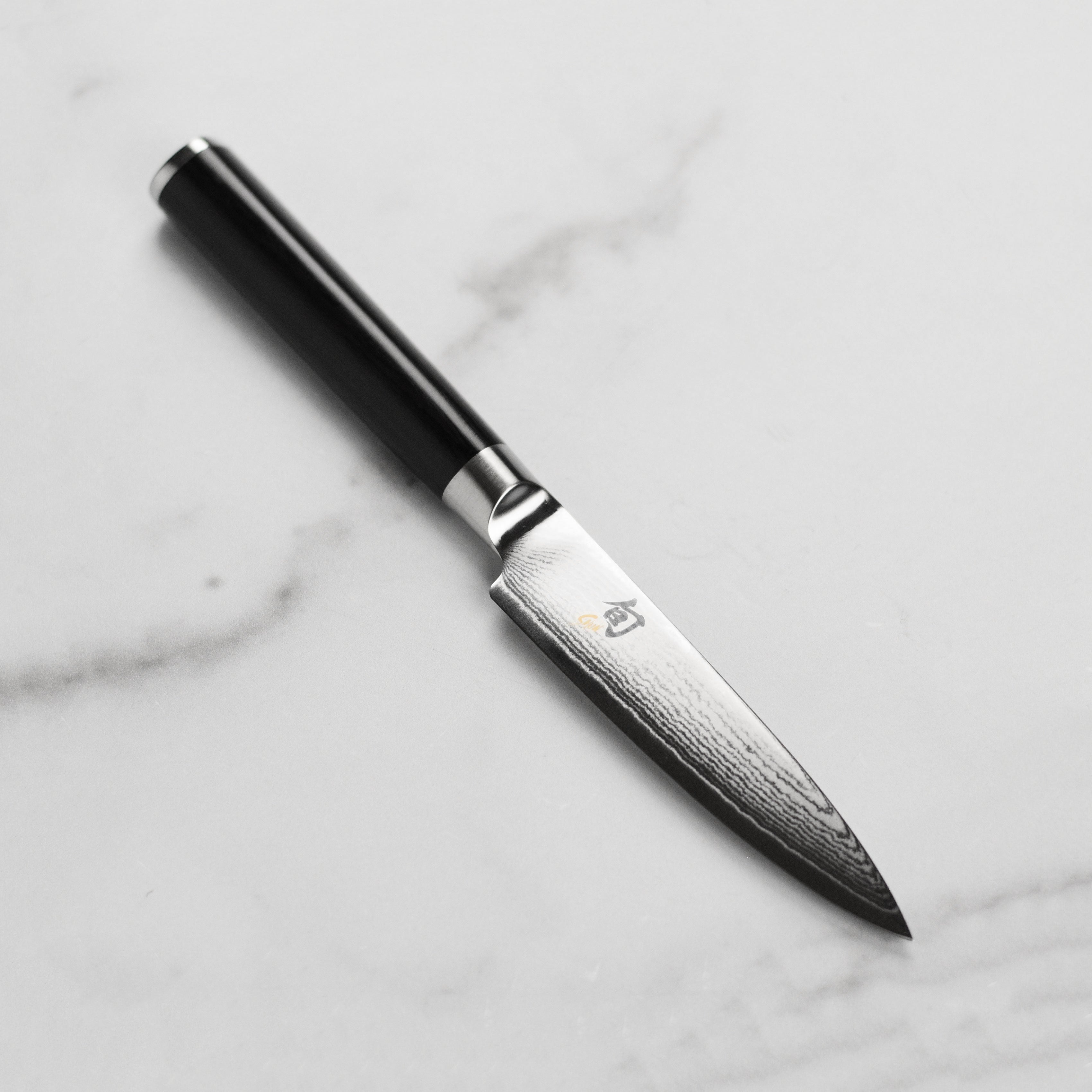 Shun Classic 4-inch Japanese paring knife with detailed blade close-up