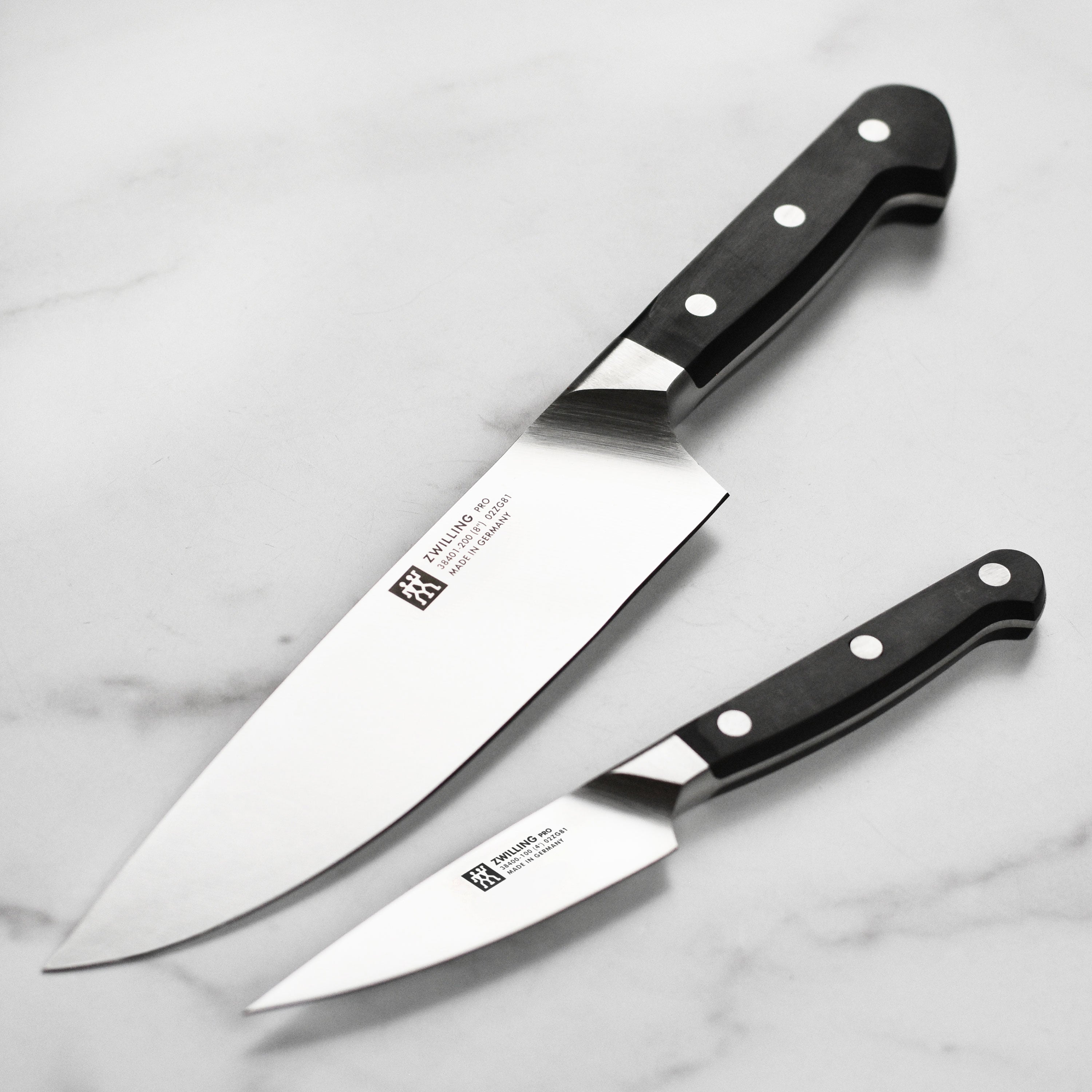 Close-up of Zwilling Pro chef knife blade showing sharp edge and craftsmanship