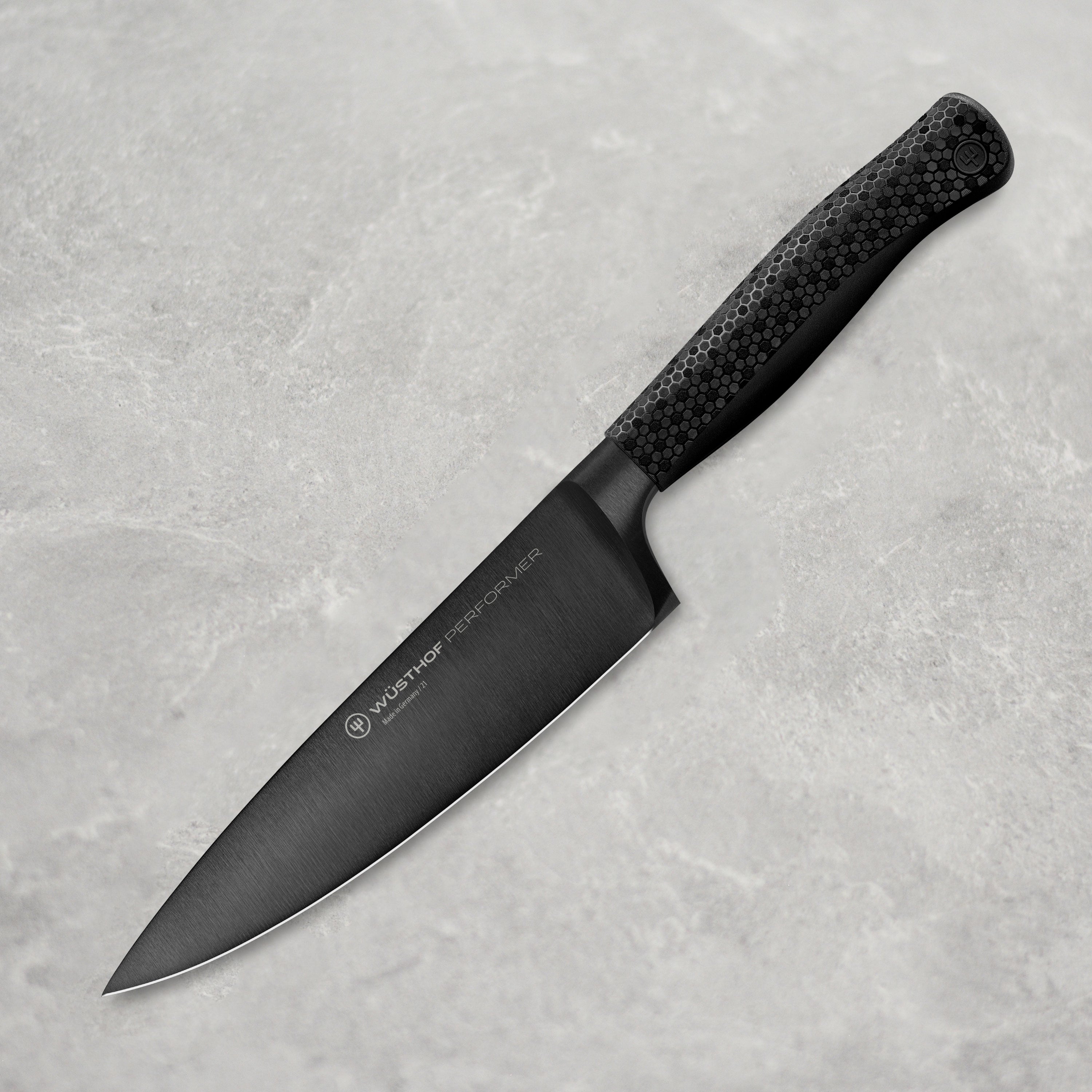 Wusthof Performer 6-Inch Chef's Knife displaying the sharp blade and ergonomic handle.
