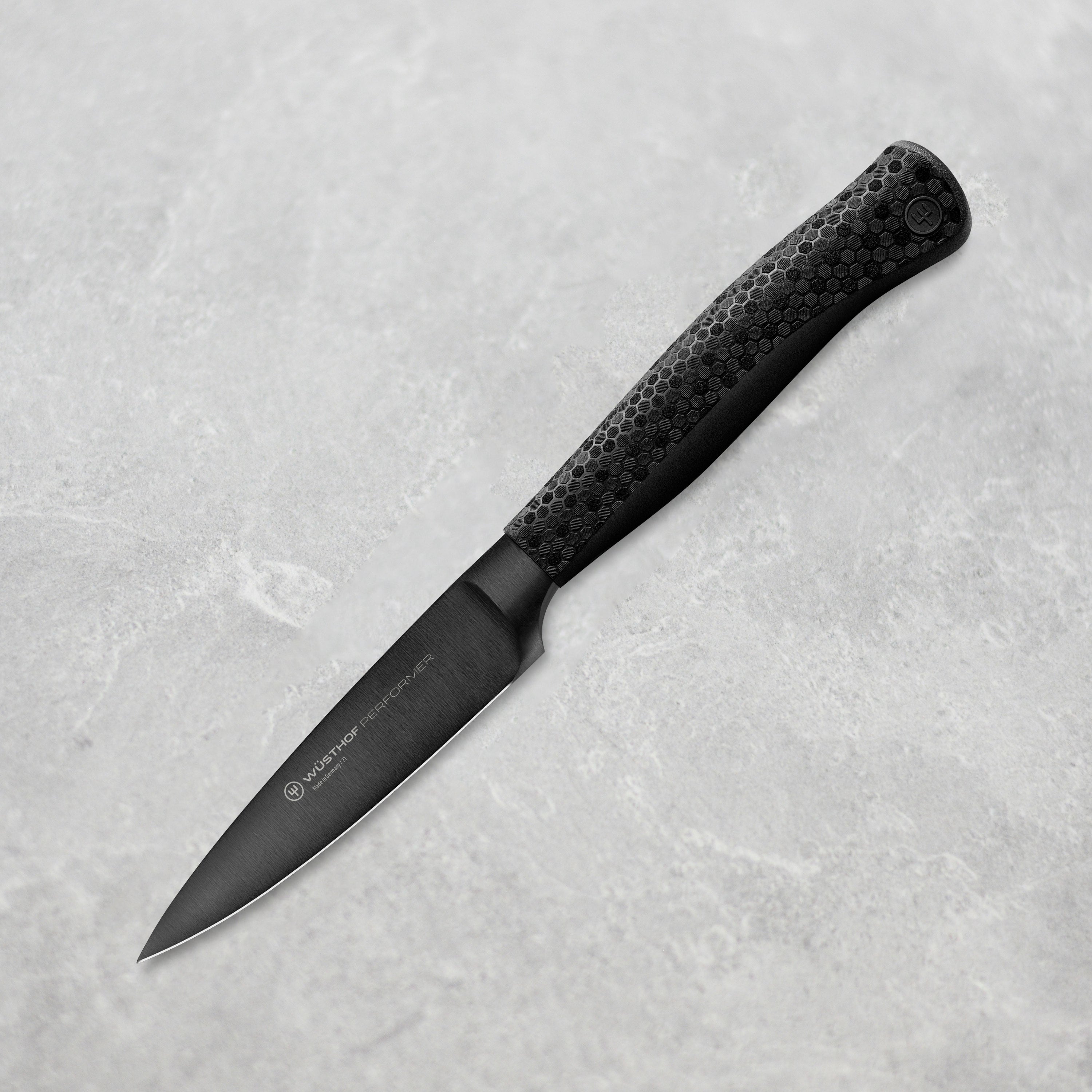 Wüsthof Performer 3.5-inch paring knife with sharp blade and ergonomic handle for precision cutting.