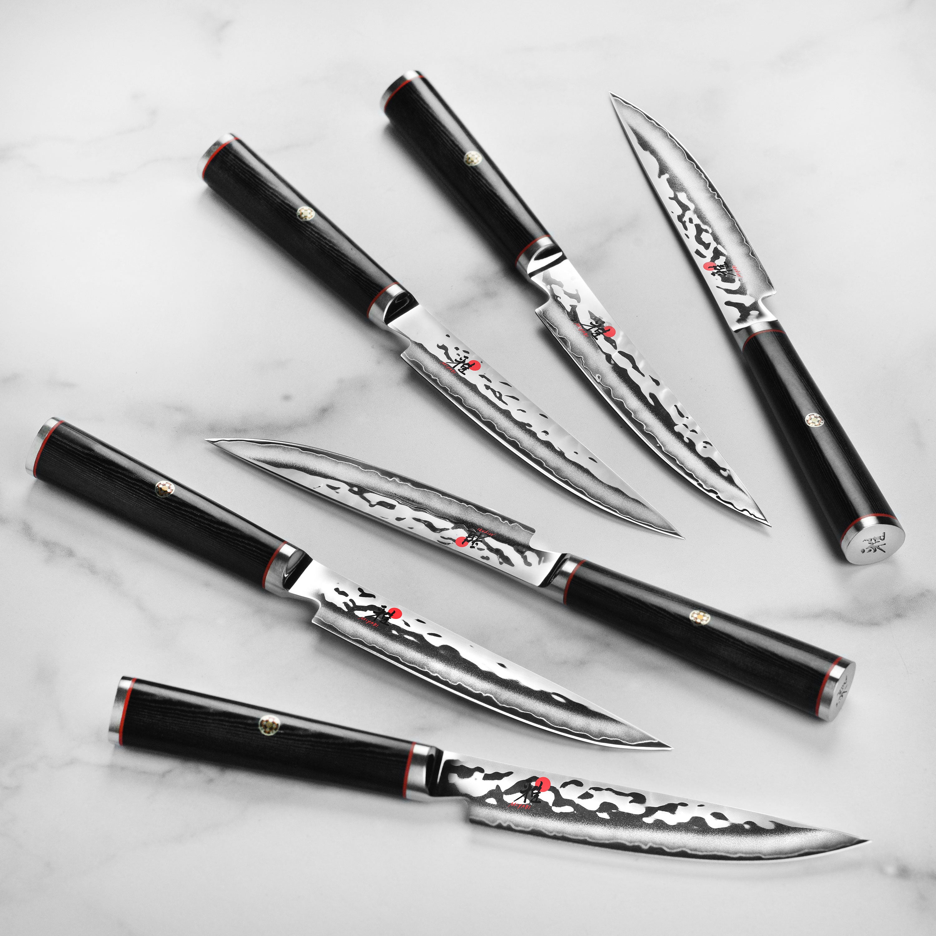 Miyabi Mizu SG2 steak knives with ergonomic Micarta handles, perfect for fine dining.